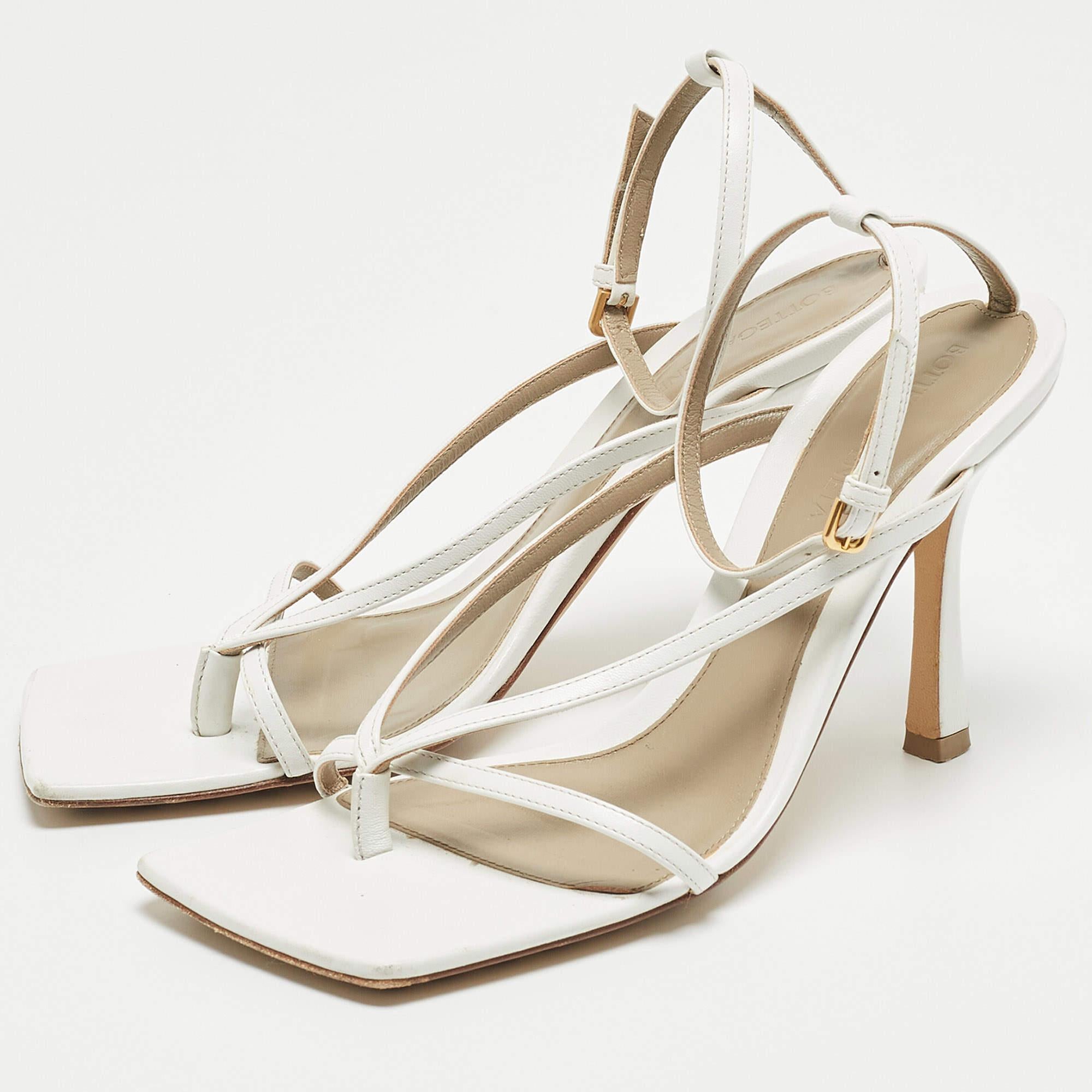 Wear these leather sandals from Bottega Veneta when you go out and watch heads turn. These white sandals have been designed in a thong style with buckled ankle straps. They are endowed with comfortable leather-lined insoles and stand tall on 10cm