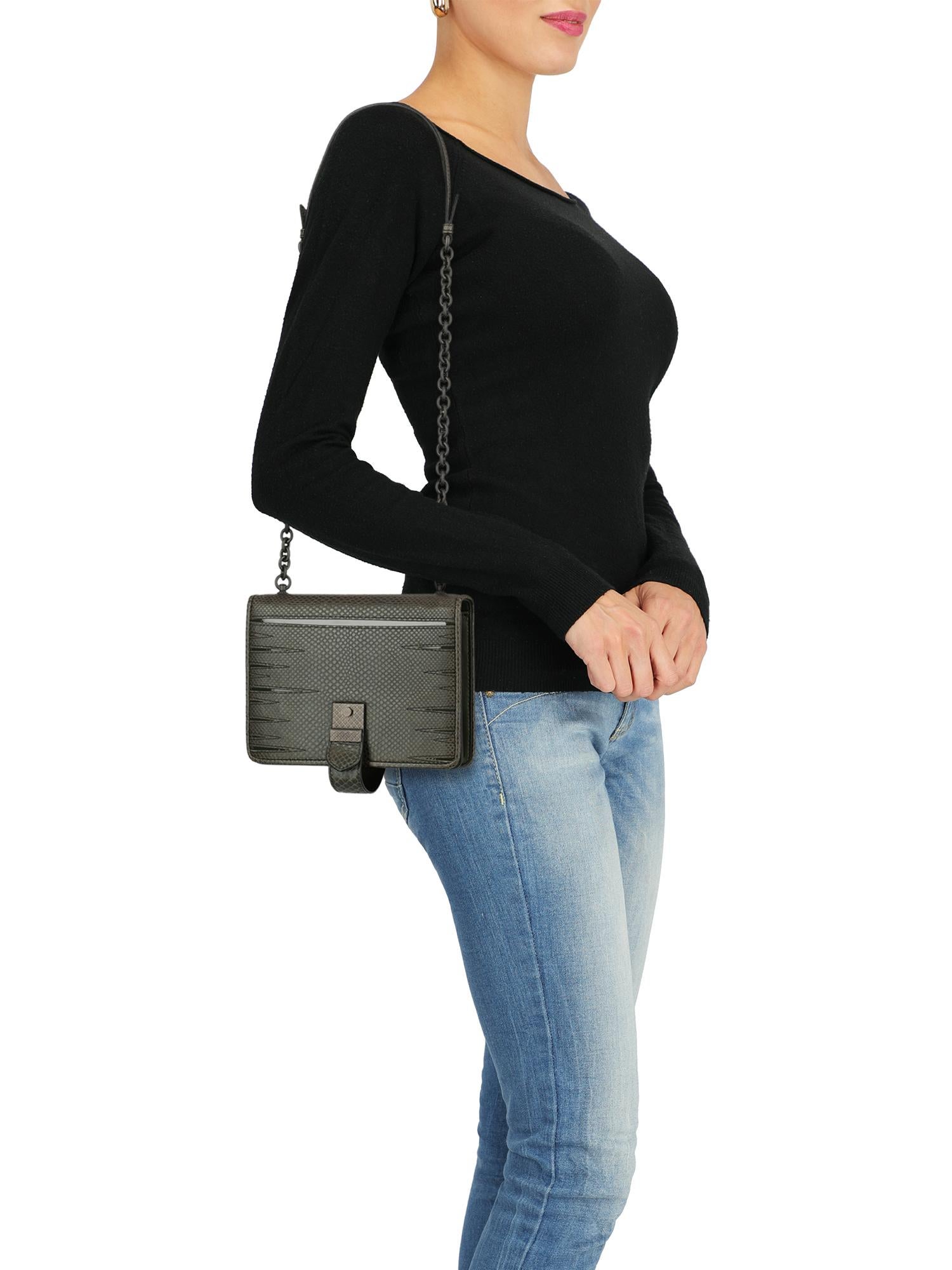 Shoulder bag, leather, solid color, internal logo, pressure lock closure, chain shoulder strap, ruthenium hardware, internal mirror, multiple internal compartments, suede lining, cut-out details, evening, mini bag. Product Condition: Like New With