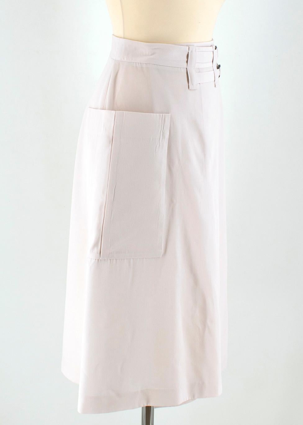 Bottega Veneta Wool Wrap Midi Skirt

- beige wool wrap skirt 
- lined
- button and double buckle fastening to the waist 
- midi length
- slip pocket embellishment to the side

Please note, these items are pre-owned and may show some signs of