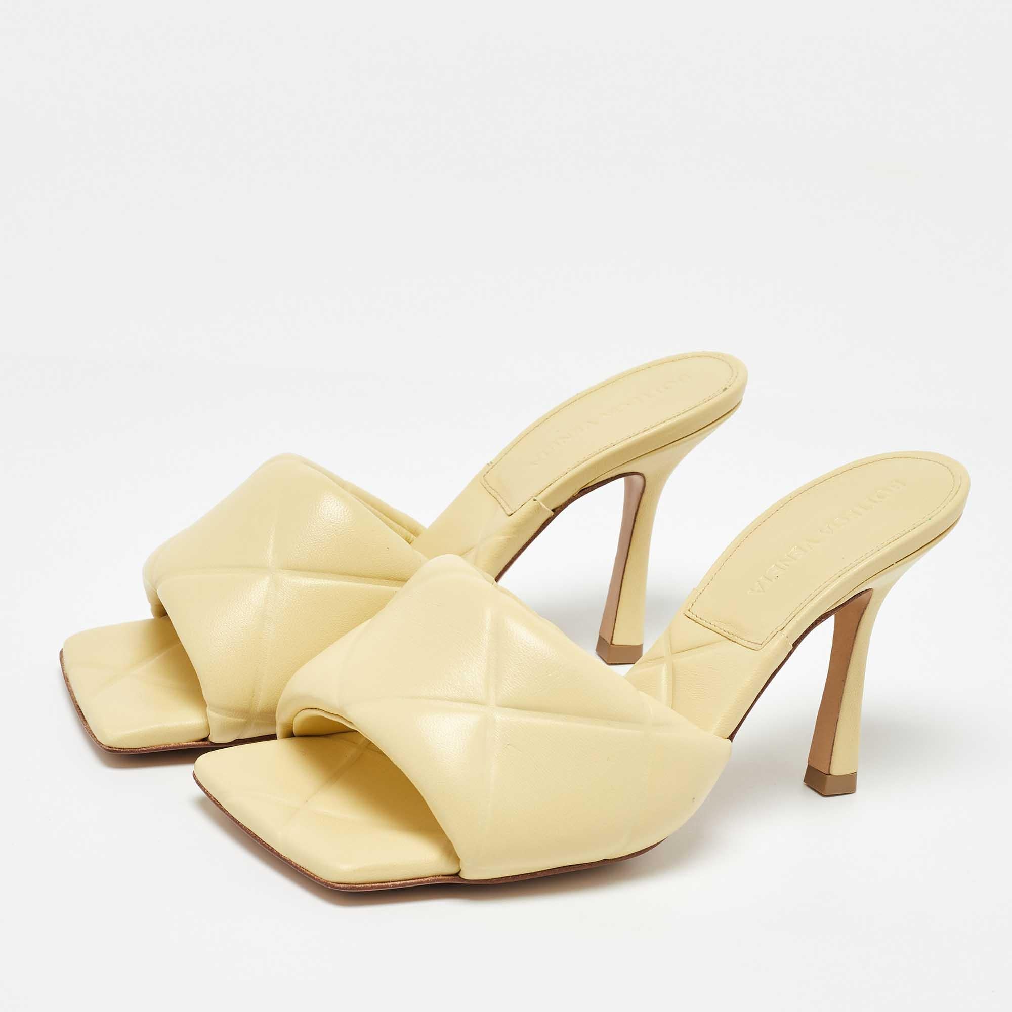 These yellow Lido sandals exhibit the best of Bottega Venetas dedication to timeless designs and meticulous craftsmanship. They are crafted from leather  designed with open square toes  high heels  and signature Intrecciato woven vamp straps to hold