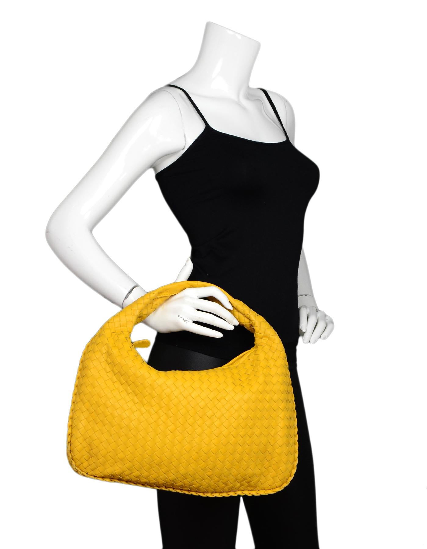 Bottega Veneta Yellow Woven Leather Nappa Intrecciato Medium Veneta Hobo Bag

Made In: Italy
Color: Yellow
Hardware: Black
Materials: Leather
Lining: Brown suede
Closure/Opening: Zip top
Exterior Pockets: None
Interior Pockets: One zippered wall