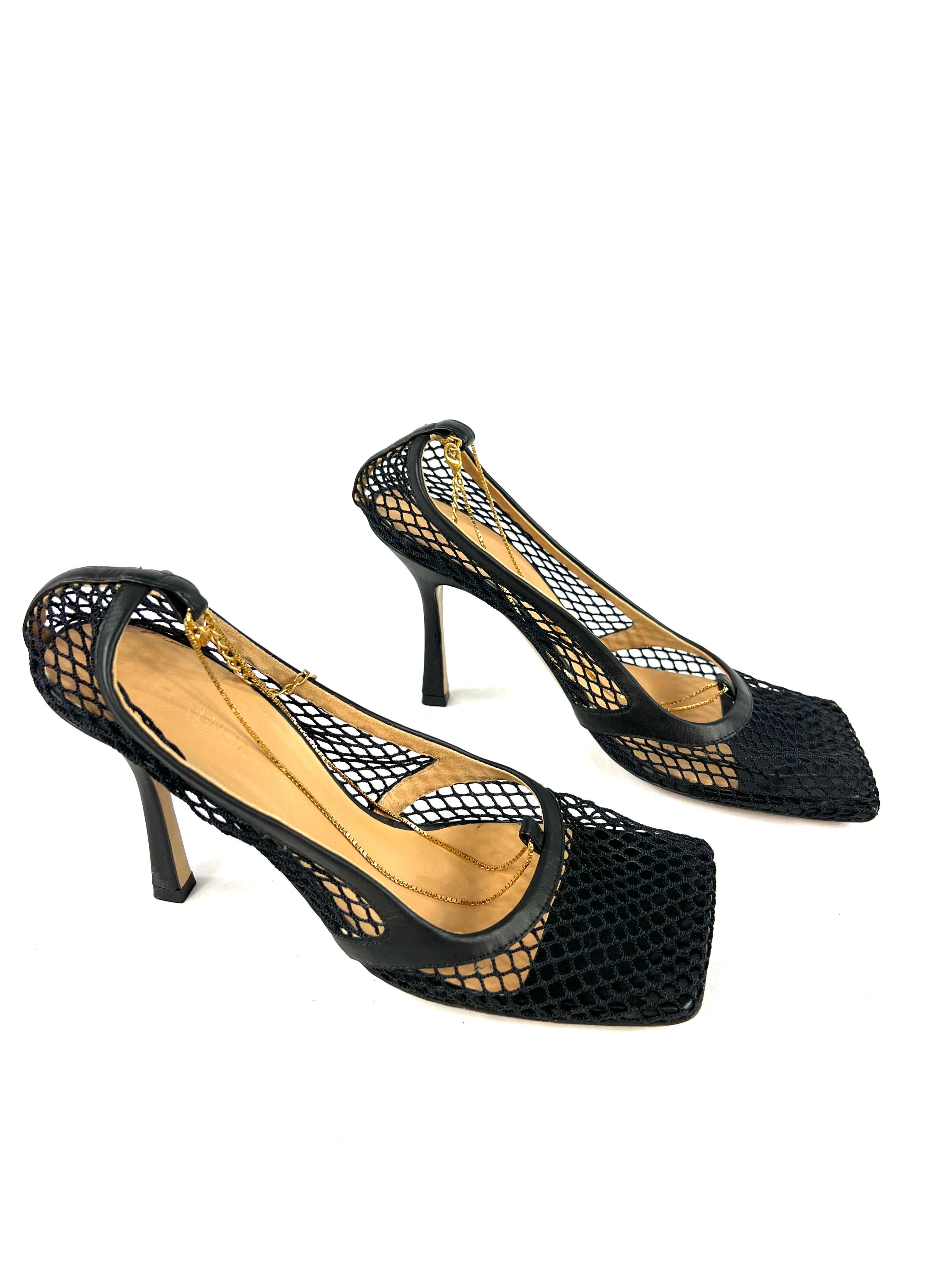Product details:

The shoes are made out of black leather and mesh with gold tone hardware chain detail. The heel height is 4”. Comes with the dust bags. Est. Retail is 1,020.