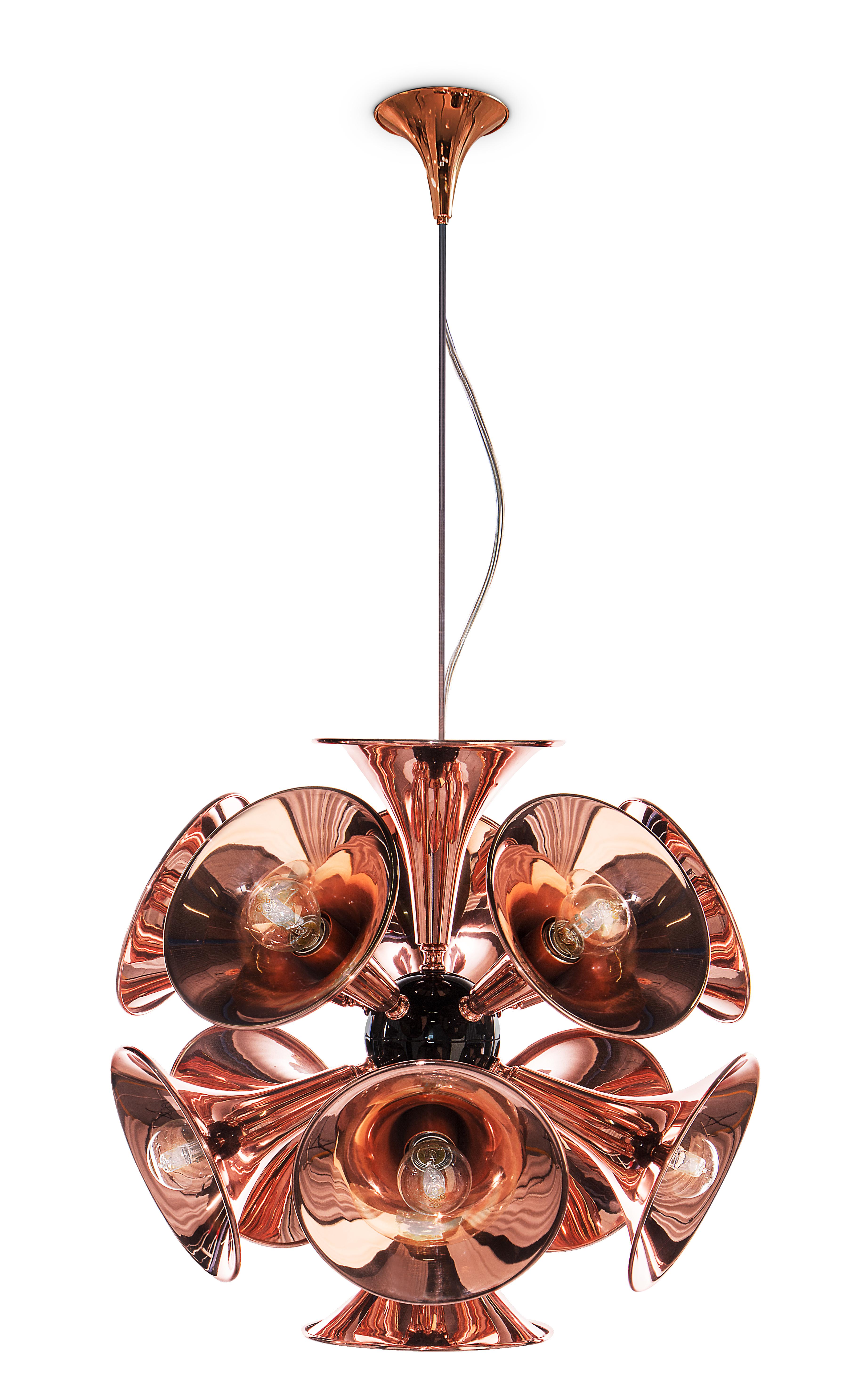 Inspired by the american trumpet player Chris Botti as a tribute to jazz music, Botti pendant lamp is a slightly smaller version of the modern chandelier with 15 trumpet-shaped shapes that stretch out from the center, creating a perfect sphere. It