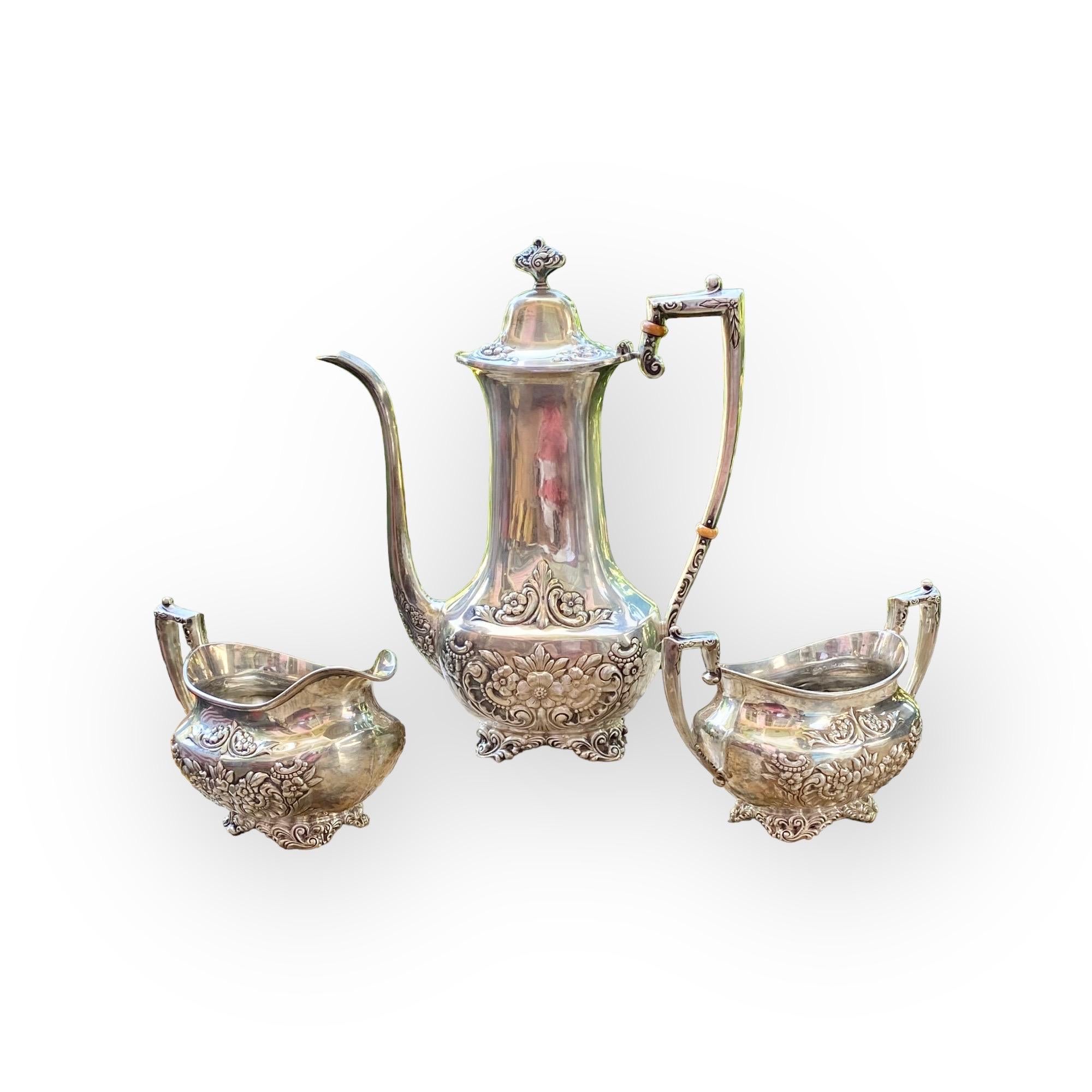A sterling silver after-dinner coffee service, consisting of one coffee pot, one open creamer and one open sugar bowl, D Whiting, Botticelli pattern. Total weight 28.55 troy ounces. 

Founded in Attleboro, Massachusetts, in 1866 by William Dean