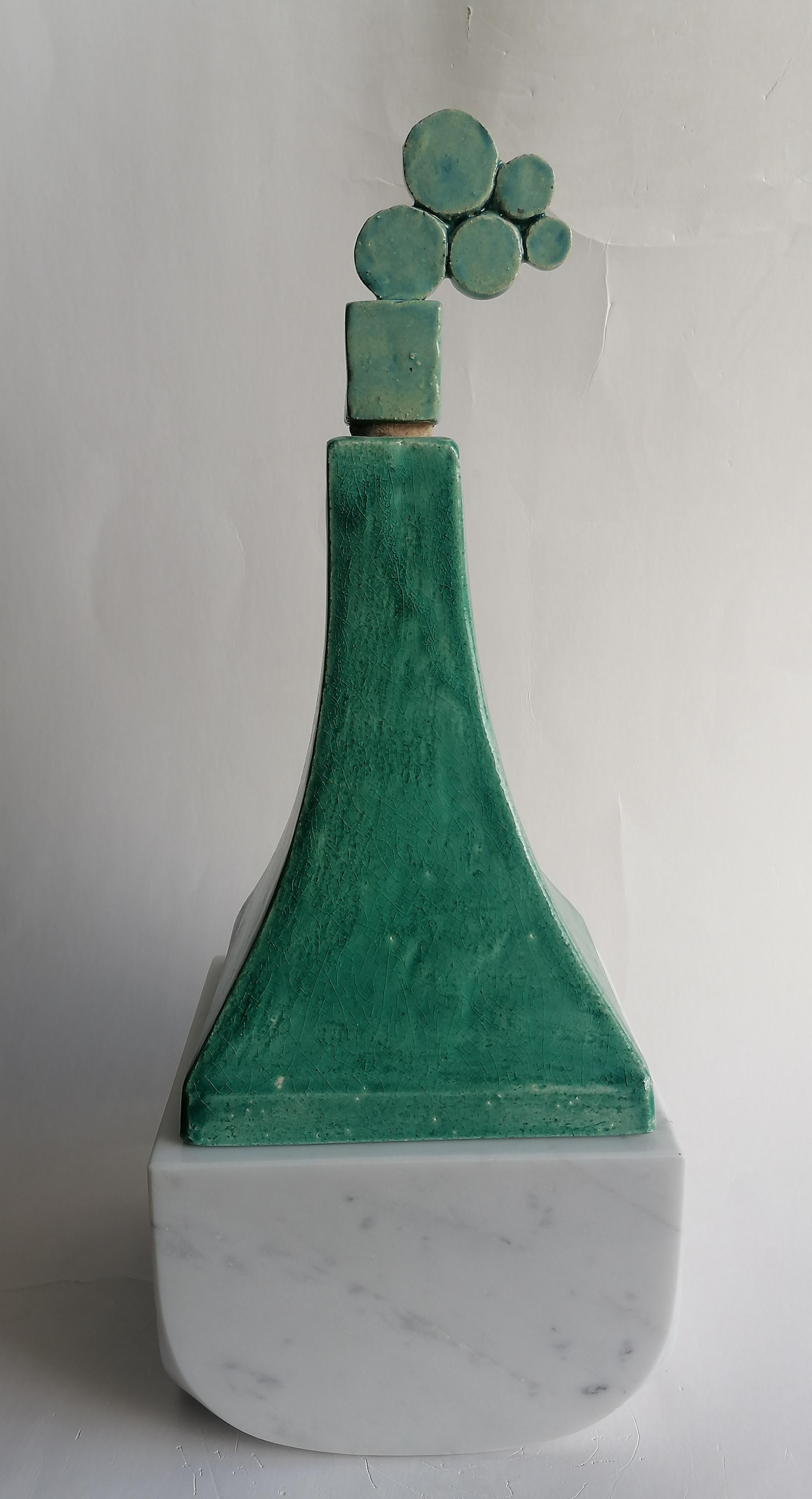 Unique design piece, combination of ceramic and marble together.
Original design object composed of two independent containers, one made of white Carrara marble, the other of glazed ceramic , which come together and create a unique shape.
height of