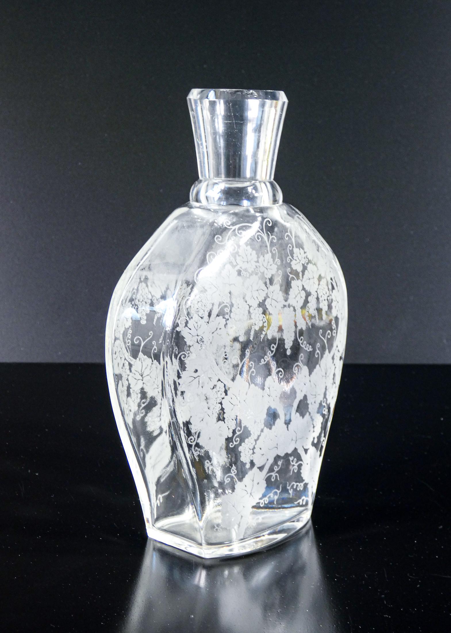 French BACCARAT crystal bottle, motif depicting a vine and bunches of grapes For Sale
