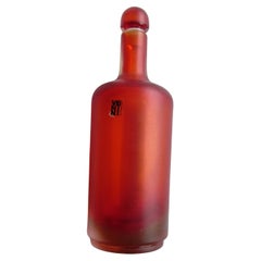 Bottiglia in vetro rosso della serie incisi di Venini, anni '90