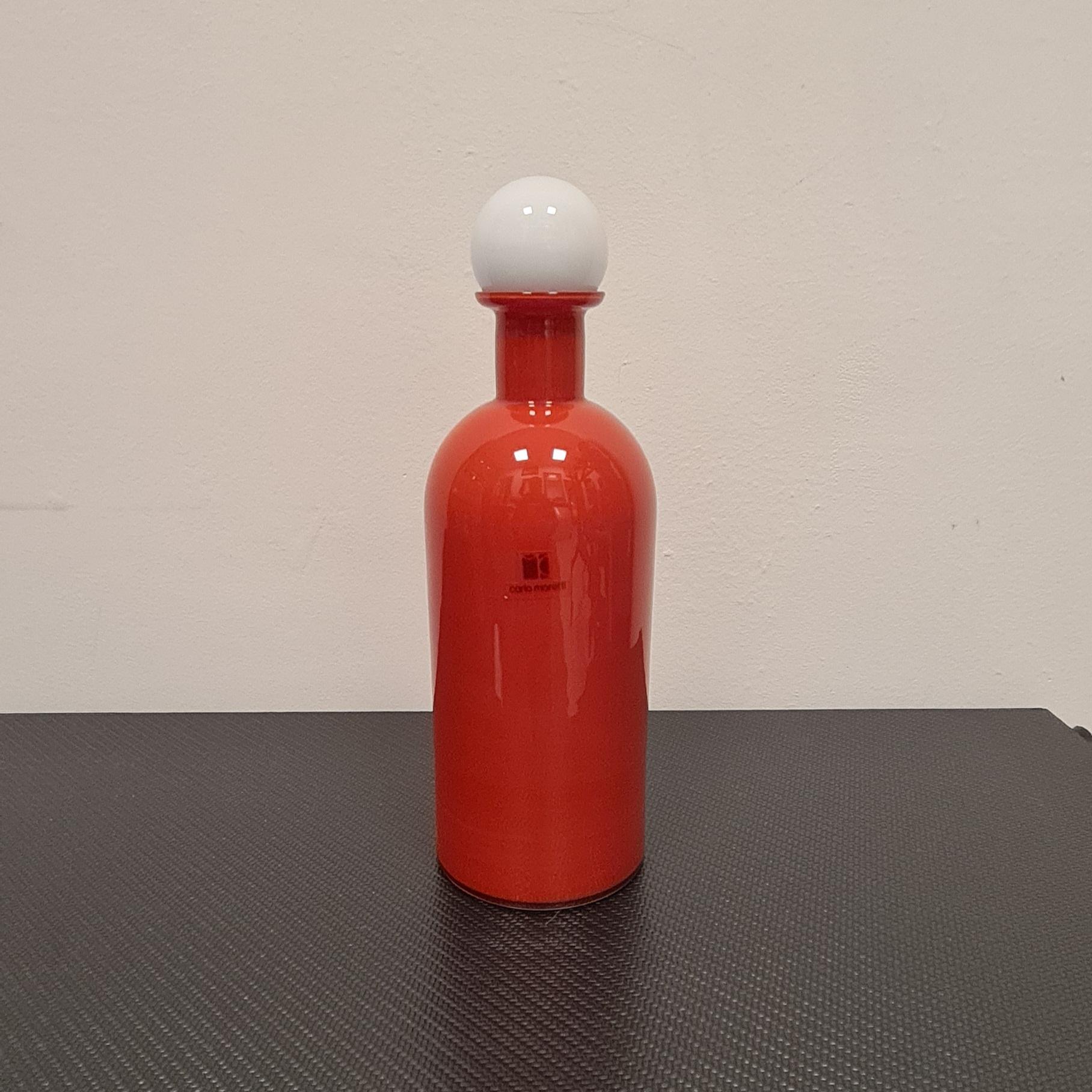 Murano glass bottle from the Carlo Moretti glassworks.

Carlo Moretti founded his eponymous glassworks in 1958 in Murano with his brother Giovanni.

Throughout its history Moretti Glassworks has had numerous collaborations including one with a very