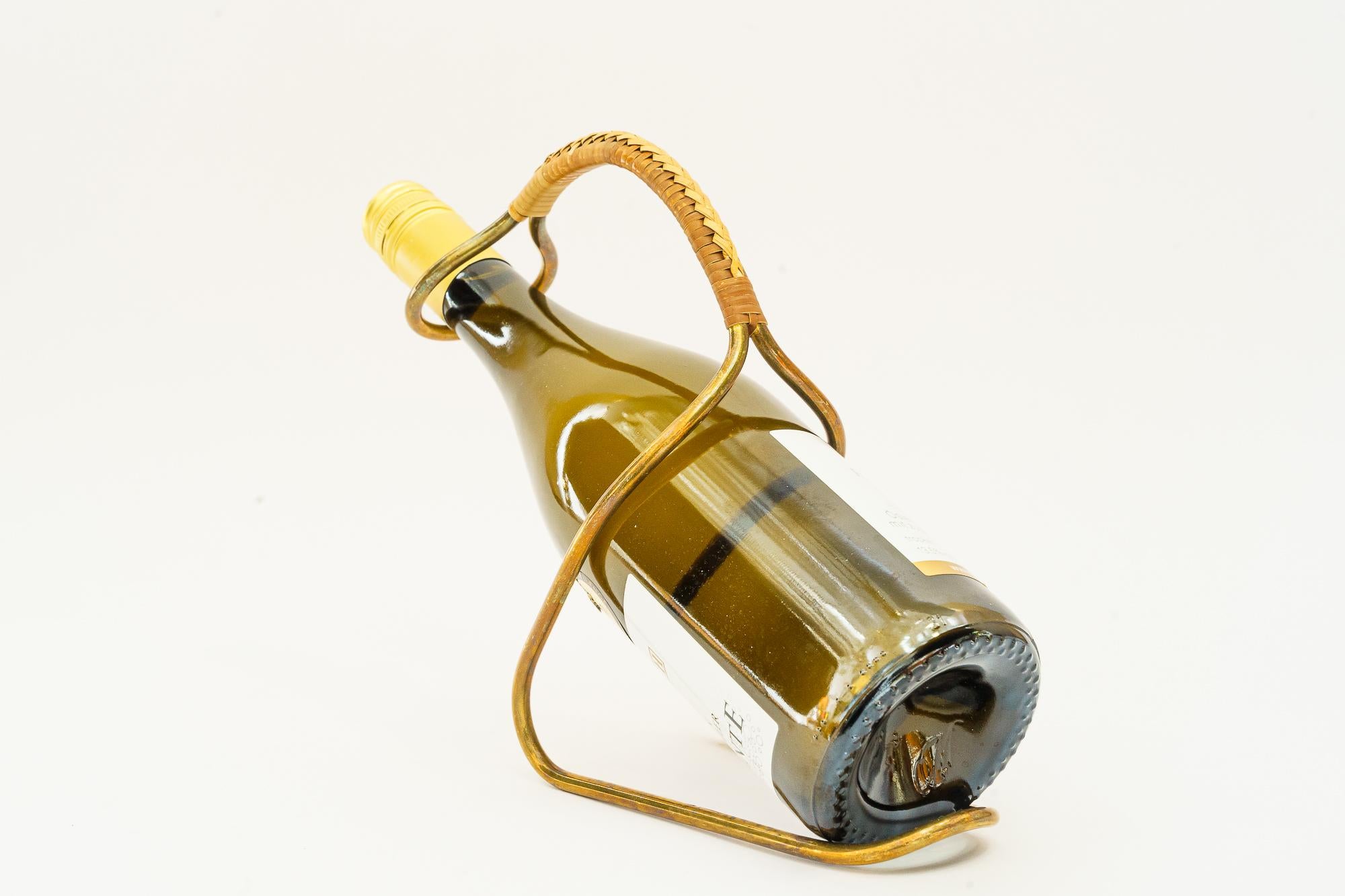 Bottle Holder by Auböck Around 1950s
The bottle is not includet it is only for the photoshooting.