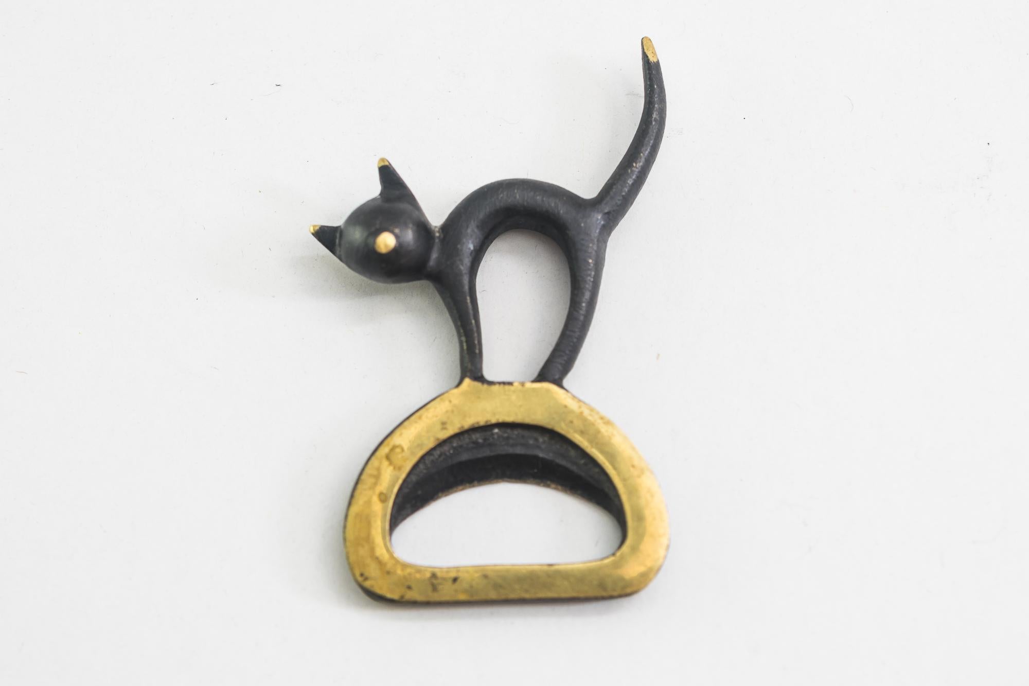 Bottle opener shows a cat by Walter Bosse, circa 1950s
Original condition.