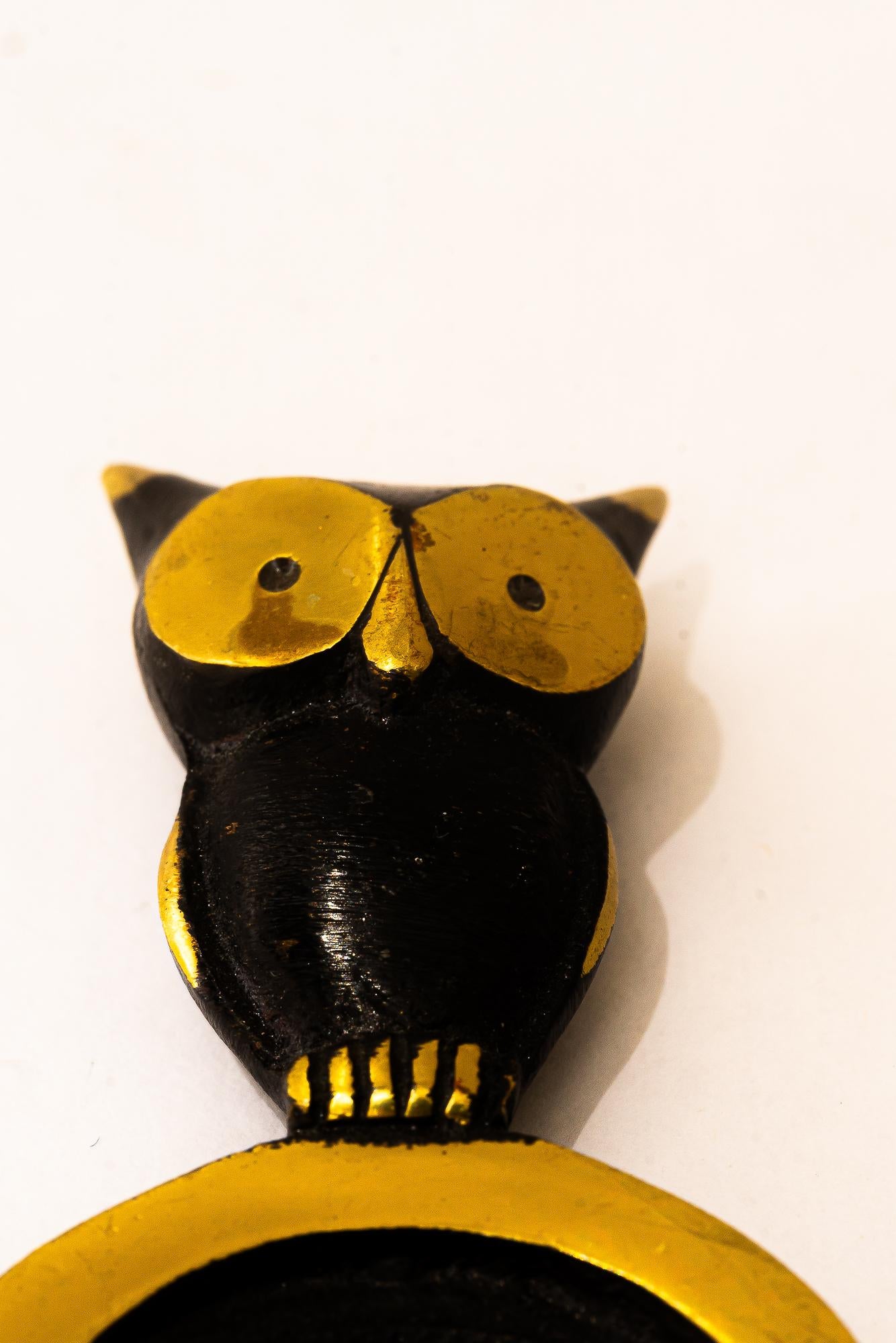 Blackened Bottle opener shows a owl bosse vienna around 1950s