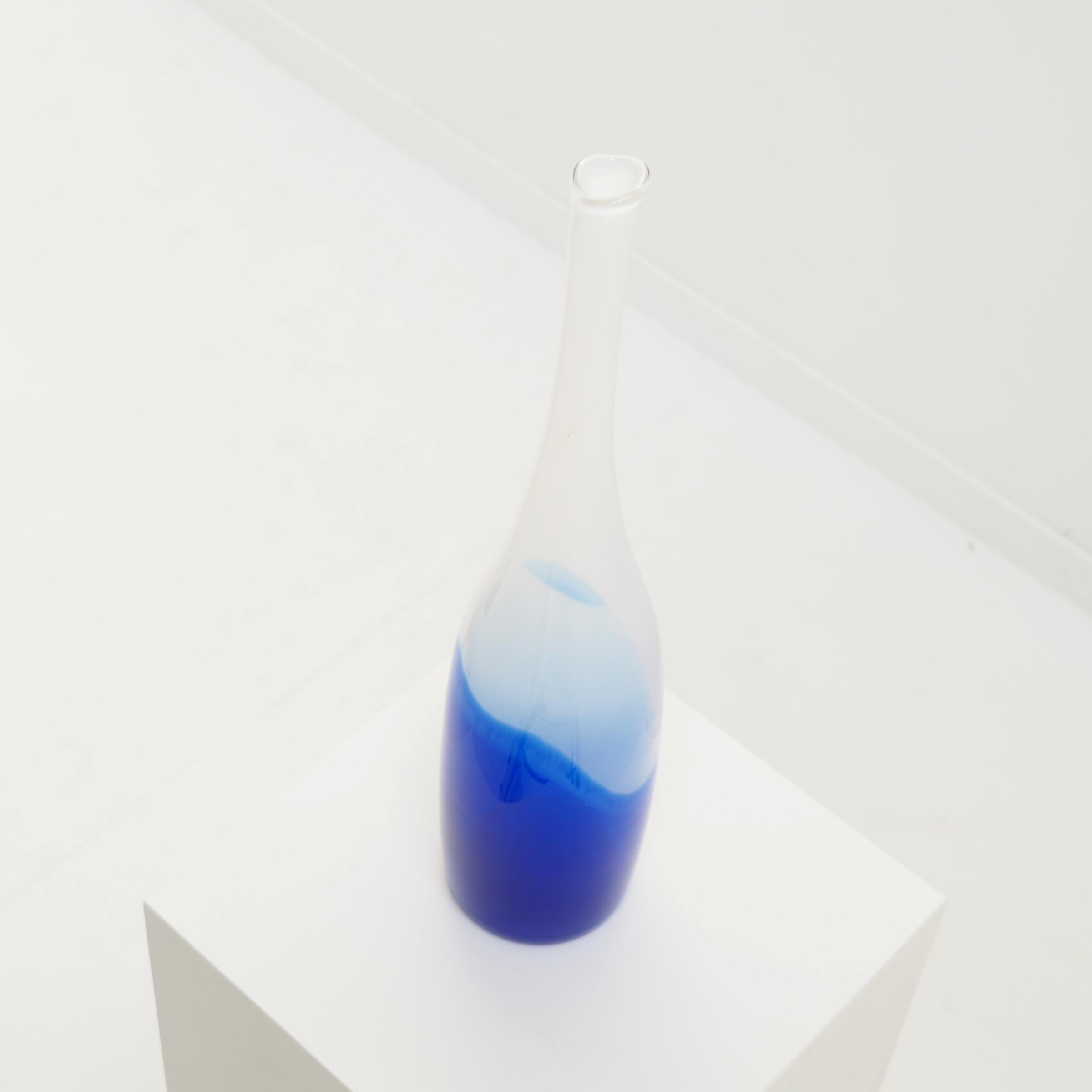 Bottle vase designed by Dutch designer Floris Meydam for ‘Glasfabriek Leerdam’.

The vase was designed in 1953 as a serica, which means that it is not a unique piece, nor is it a mass produced object. Meydam used sleek and simple, industrial shapes