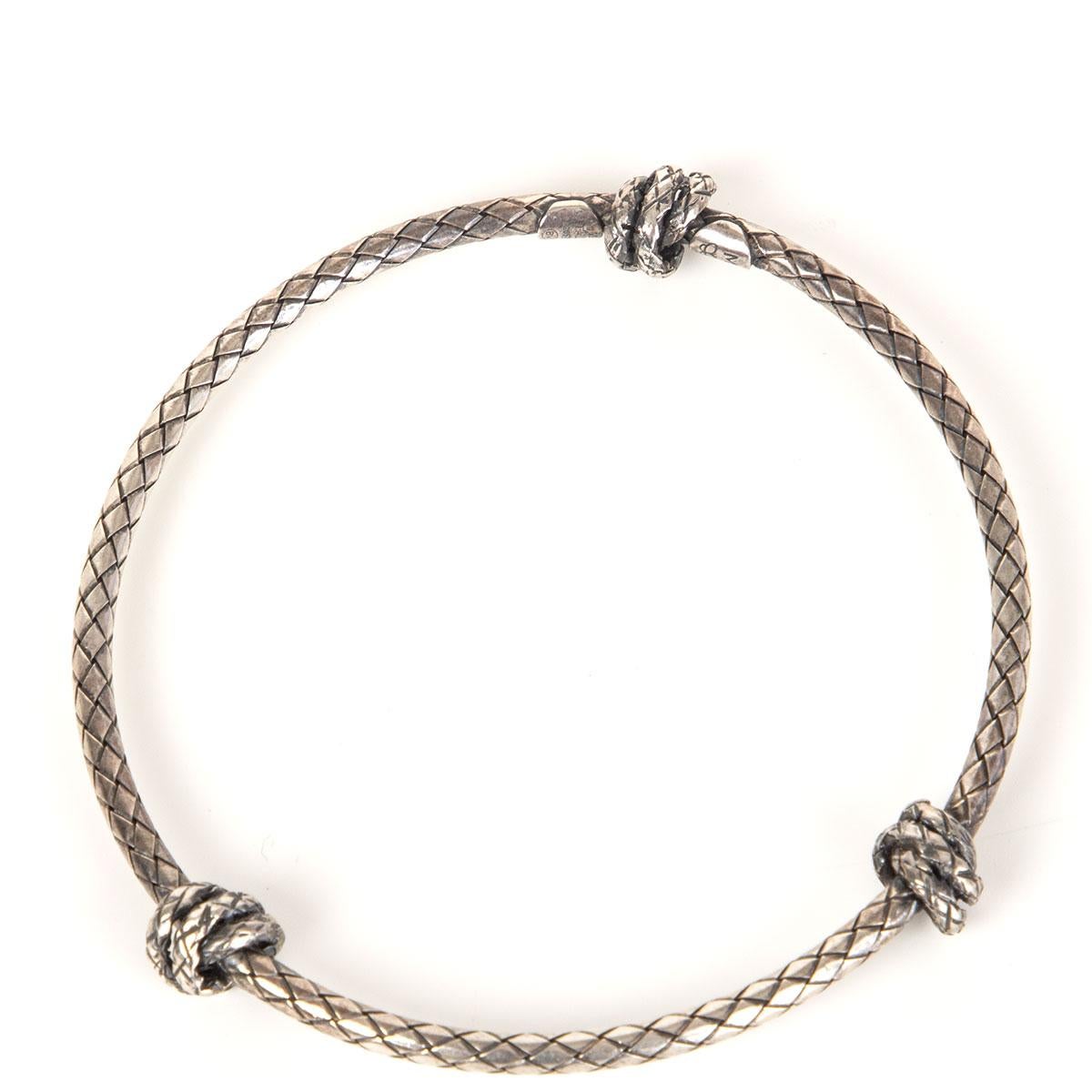 Bottega Veneta intrecciato bangle in oxidized sterling silver with three knots. Has been worn and is in excellent condition.

Circumference 20cm (7.8in)
