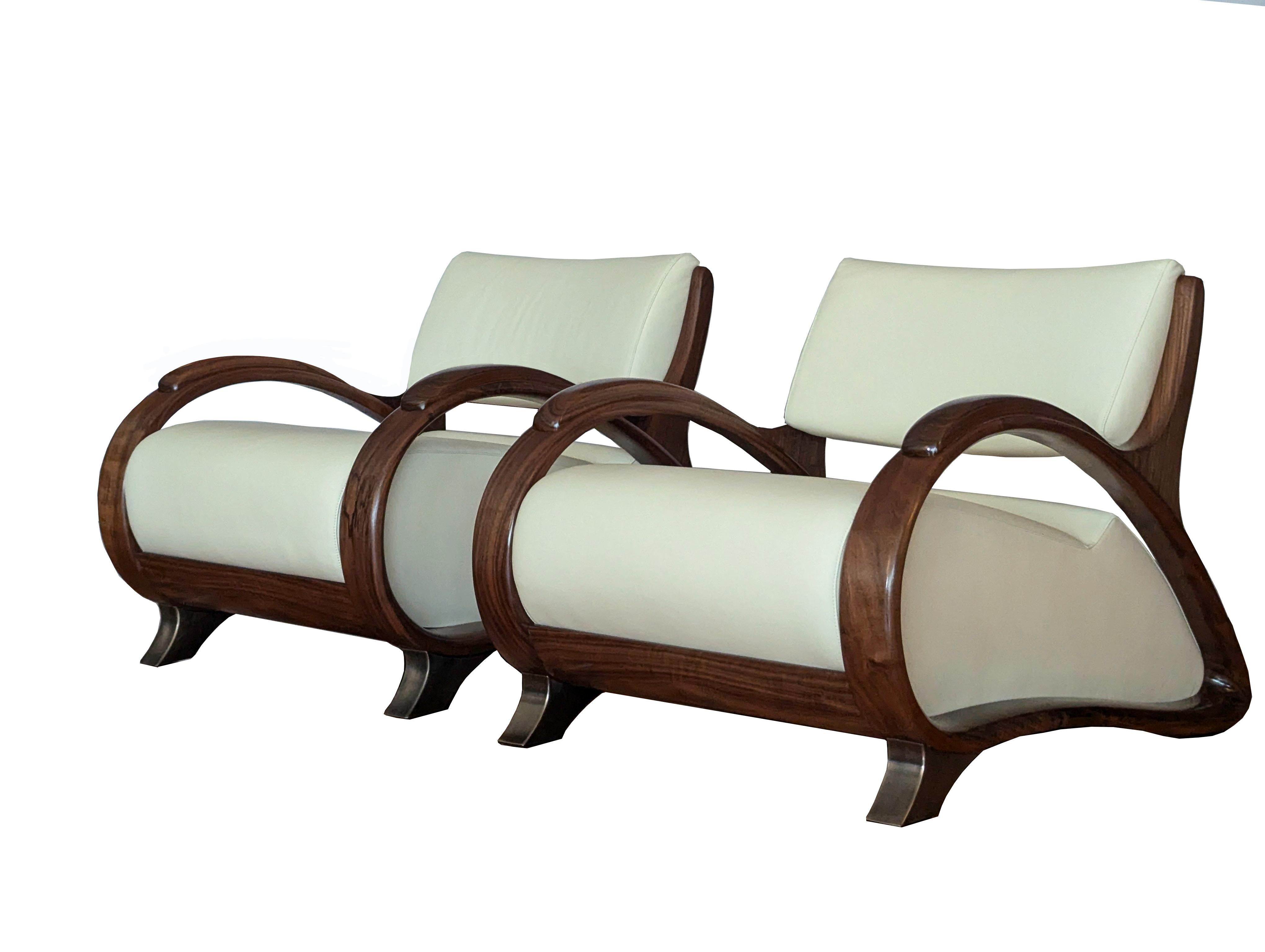 BOUCHER CLUB CHAIR

An icon of style, sophistication, quality and comfort.
Sensuous contemporary design with Art Deco influence.  

Individually handmade from steam bent and hand carved solid Walnut, bespoke cast bronze feet and superbly soft