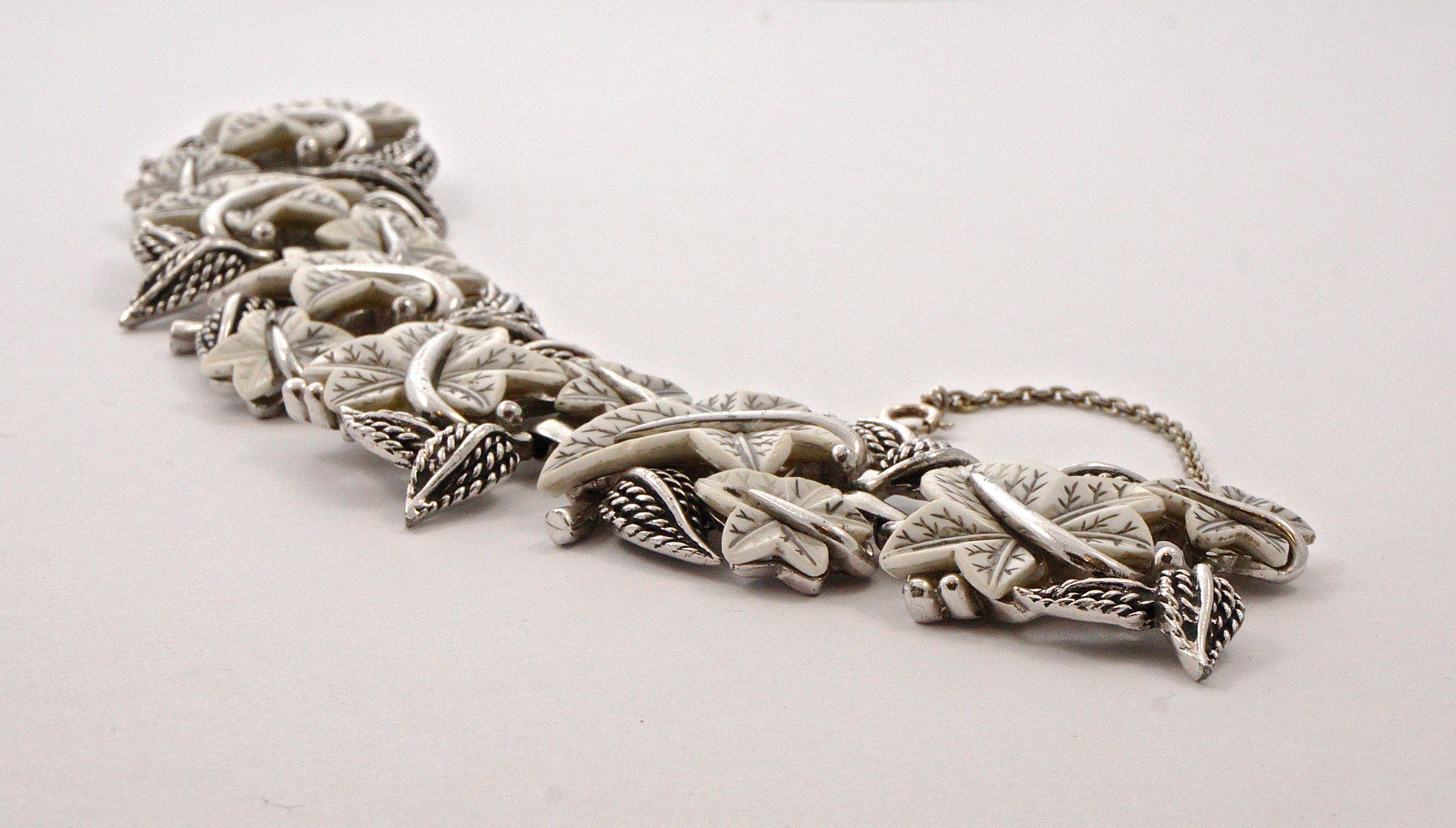 Boucher fabulous silver plated link bracelet, featuring wonderful white glass ivy leaves with engraved grey veins. Measuring length 19cm / 7.5 inches by width approximately 3.3cm / 1.3 inches. The grey veins have some wear, the very pale gold tone