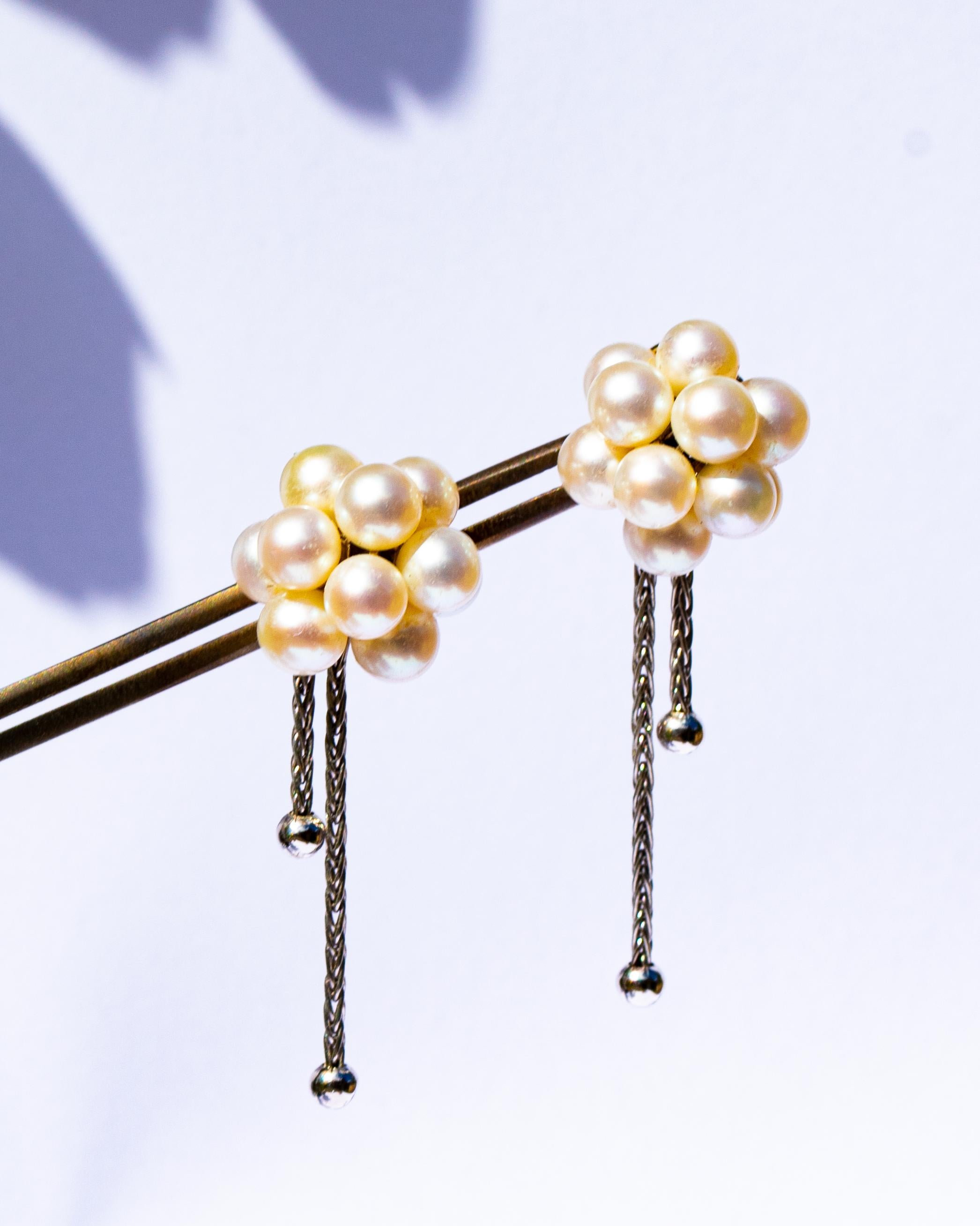 Pair of Boucheron 18 carat gold and pearl cluster earrings, each suspended with a pair of chains, 3cm drop, 8.1g gross
