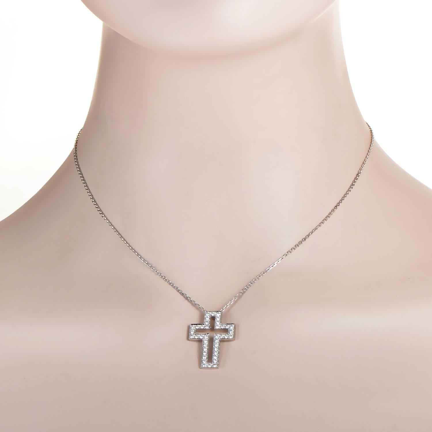 Honoring the timeless principles of minimalist elegance and tasteful glamour, this fabulous necklace from Boucheron relies on the powerful symbol of a cross and its magnetic appeal, while 18K white gold and approximately 1.00 carat of diamonds