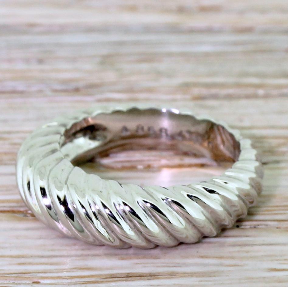 A beautiful and typically quirky band from one of the leading French jewellery houses. This nicely heavy ring graduates in height and weight, with groove detailing that continues fully around the ring. Can be worn as an alternative style wedding