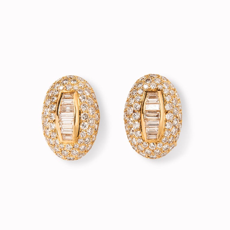 Bursting with late-70s glamour, Boucheron’s day and night diamond earrings are the essence of versatility for today’s busy world. An elegant oval bombe form is set with round and baguette diamonds and suspends a detachable pendant further set with