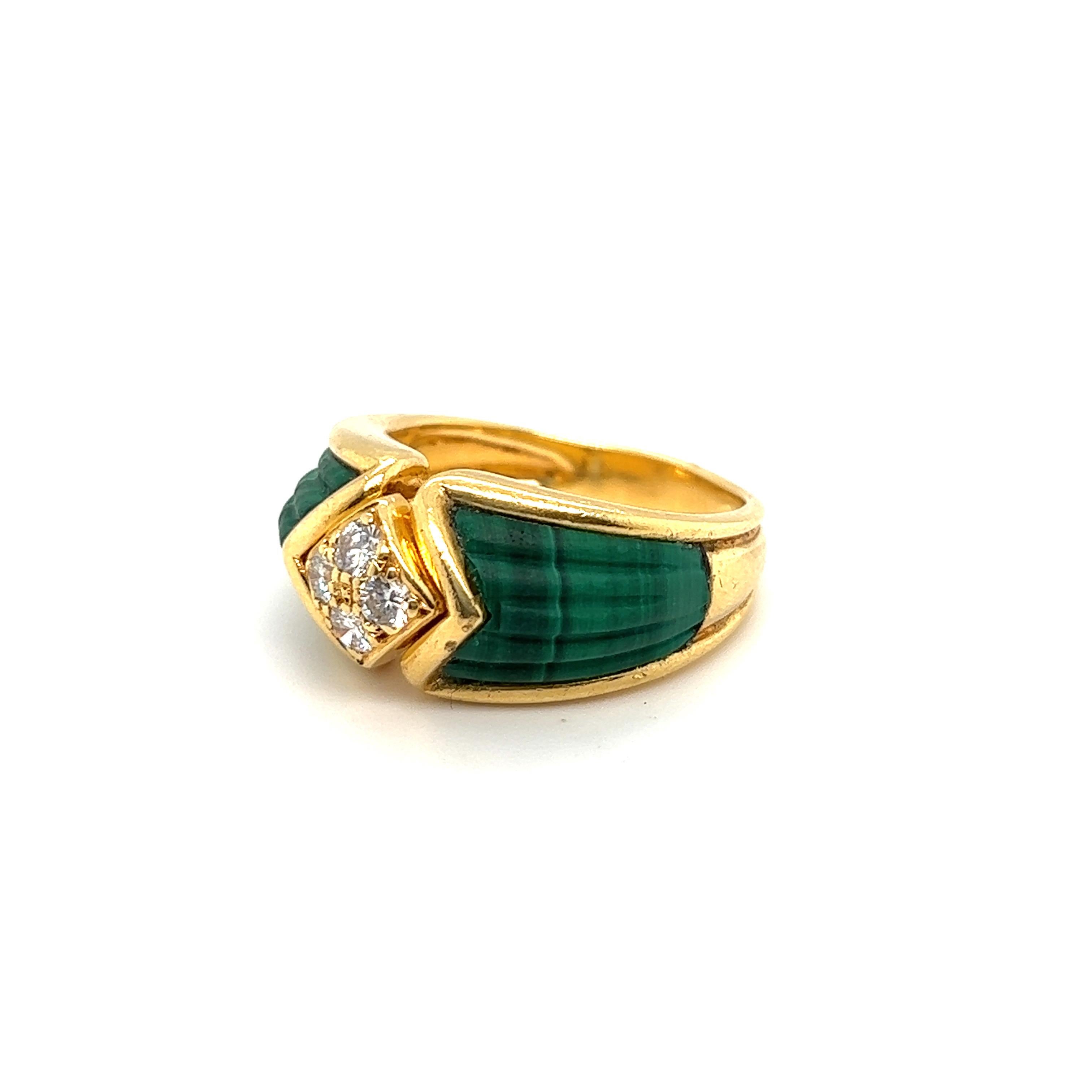 Attractive 18 karat yellow gold, diamond and malachite ring by French jewelry house Boucheron, 1970s. 
Designed as a slightly bombé band ring centering upon a lozenge shaped element set with 4 brilliant-cut diamonds totalling circa 0.2 carats