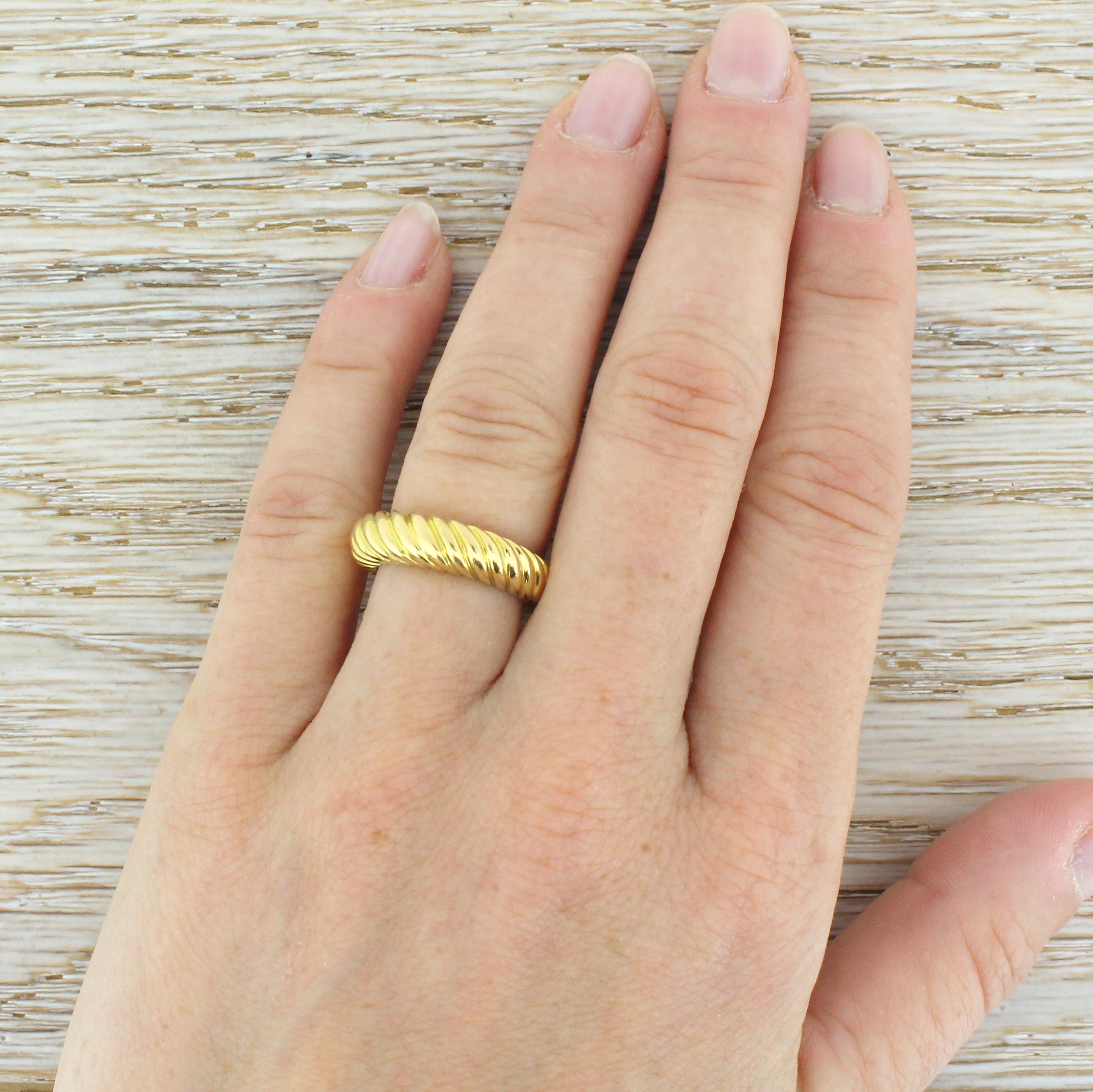A beautiful and typically quirky band from one of the leading French jewellery houses. This nicely heavy ring graduates in height and weight, with groove detailing continues fully around the ring. Can be worn as an alternative style wedding band or