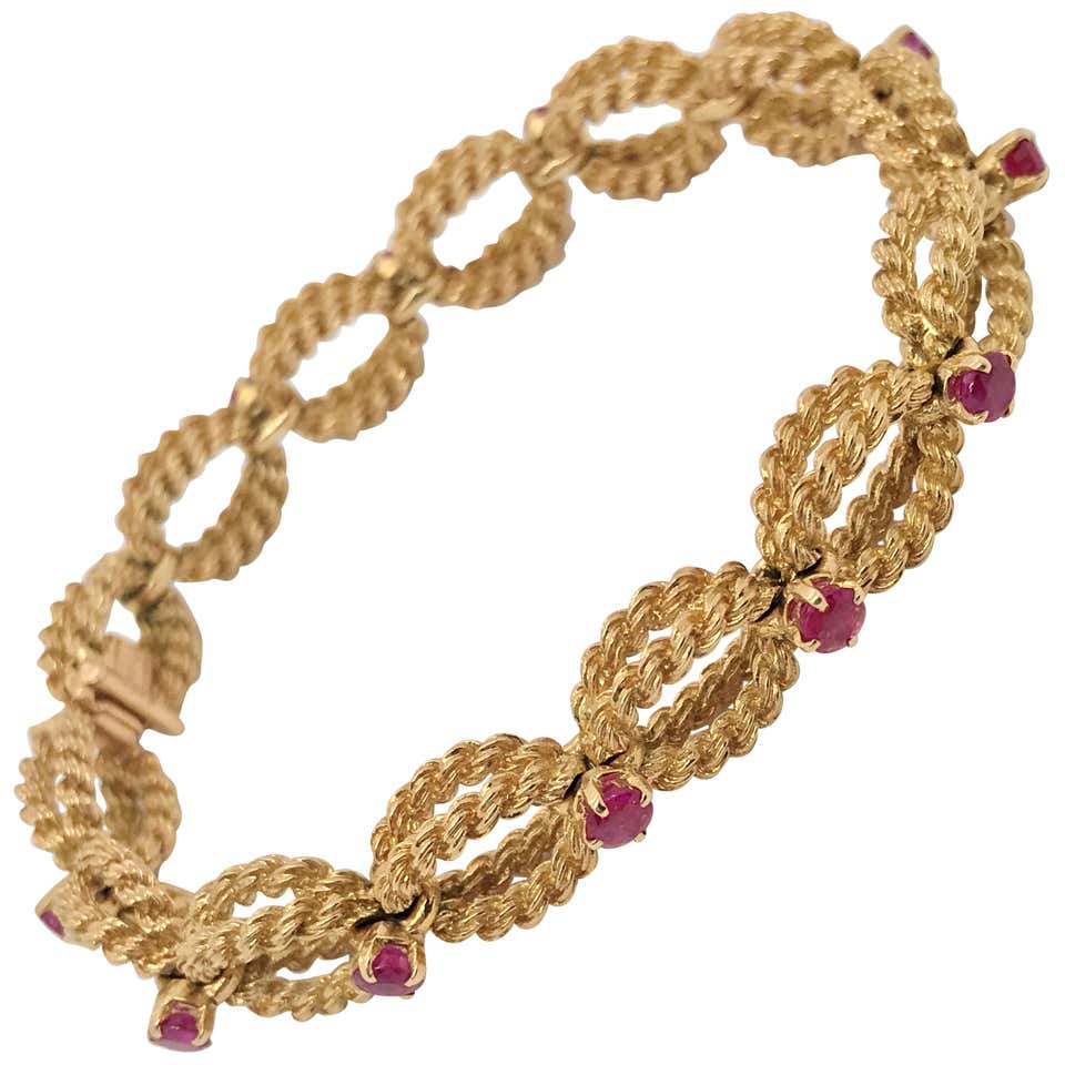 Boucheron 18 Karat Yellow Gold Woven Rope and Ruby Bracelet at 1stDibs