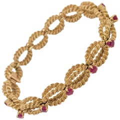 Boucheron 18 Karat Yellow Gold Woven Rope and Ruby Bracelet