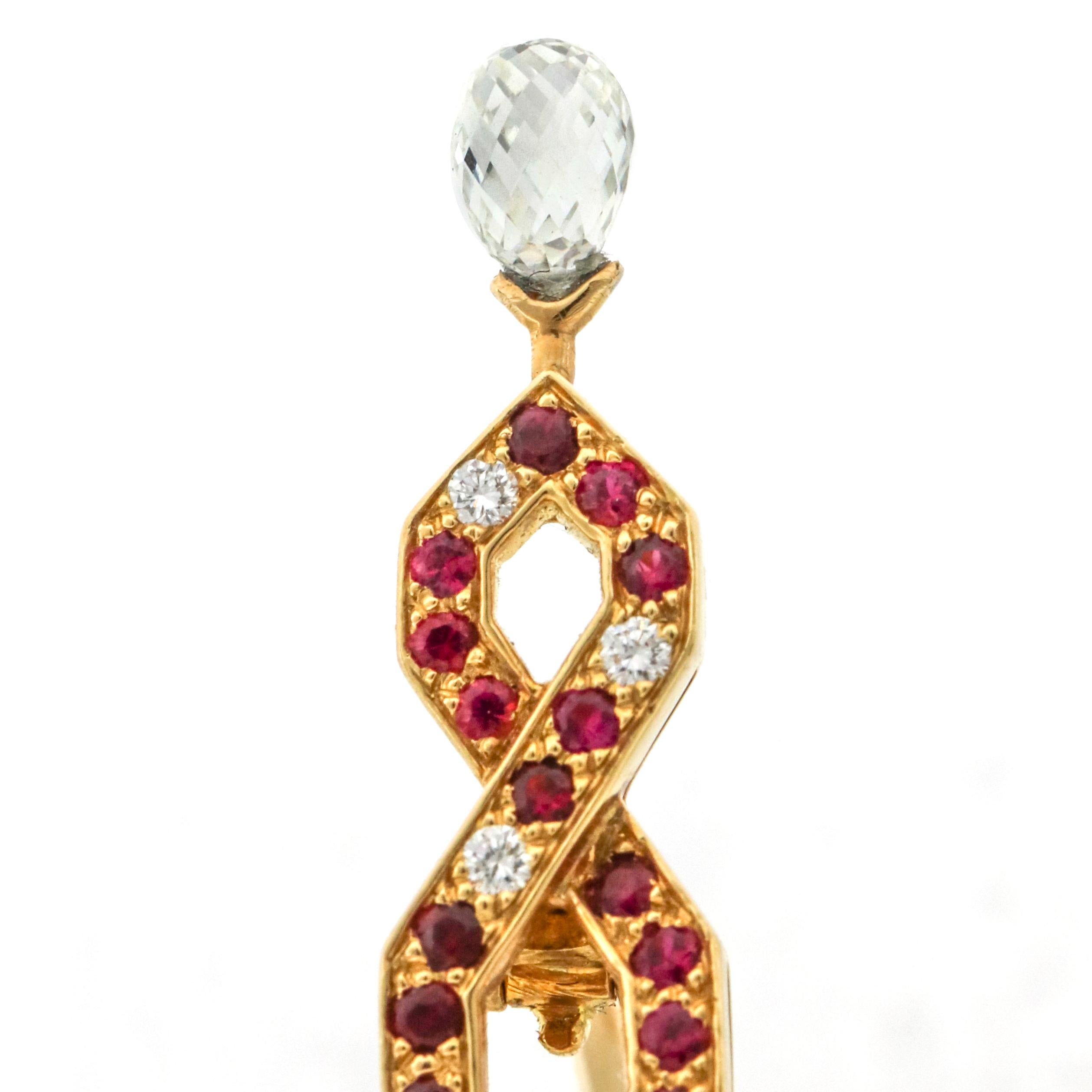 Paris Eiffel Tower brooch by Boucheron crafted in 18-karat yellow gold with rubies and diamonds. The pin has 149 round natural rubies, 17 round brilliant cut diamonds and a pear shaped faceted diamond. Signed, Boucheron with serial number.

Ruby