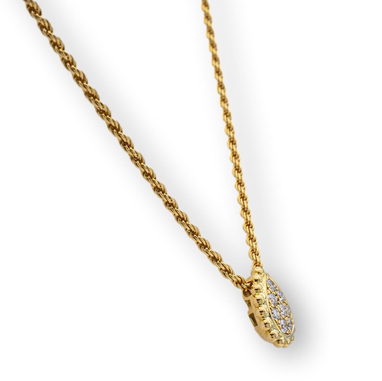 Boucheron pendant from the Serpent Boheme collection finely crafted in 18 Karat Rose Gold featuring a pear shape pendant studded with pave set round brilliant cut diamonds weighing .13 carats total weight hanging off a rope necklace with a lobster