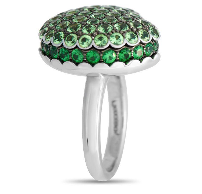Light and dark green Tsavorite gemstones totaling 4.08 carats make a statement on virtually every inch of this charming Boucheron ring. Designed to resemble a sweet macaron, this elegant ring features an 18K White Gold setting with a 2mm band width