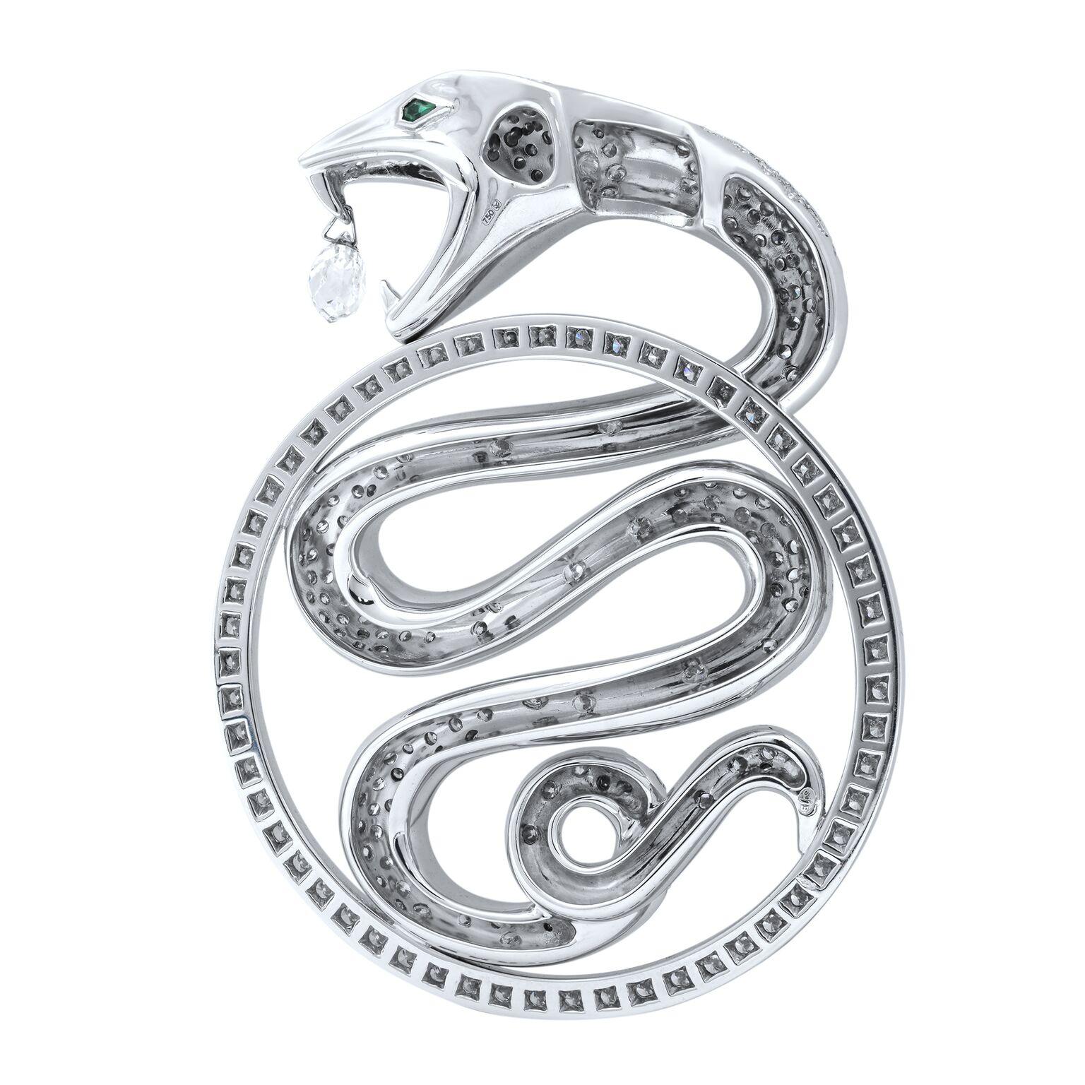 This is a precious 18k white gold Trouble pendant from Boucheron. The snake, an iconic guardian and a cultural symbol of protection is set with emerald eyes which weight 0.05ct. The pendant has 330 pave set round brilliant cut diamonds with a total