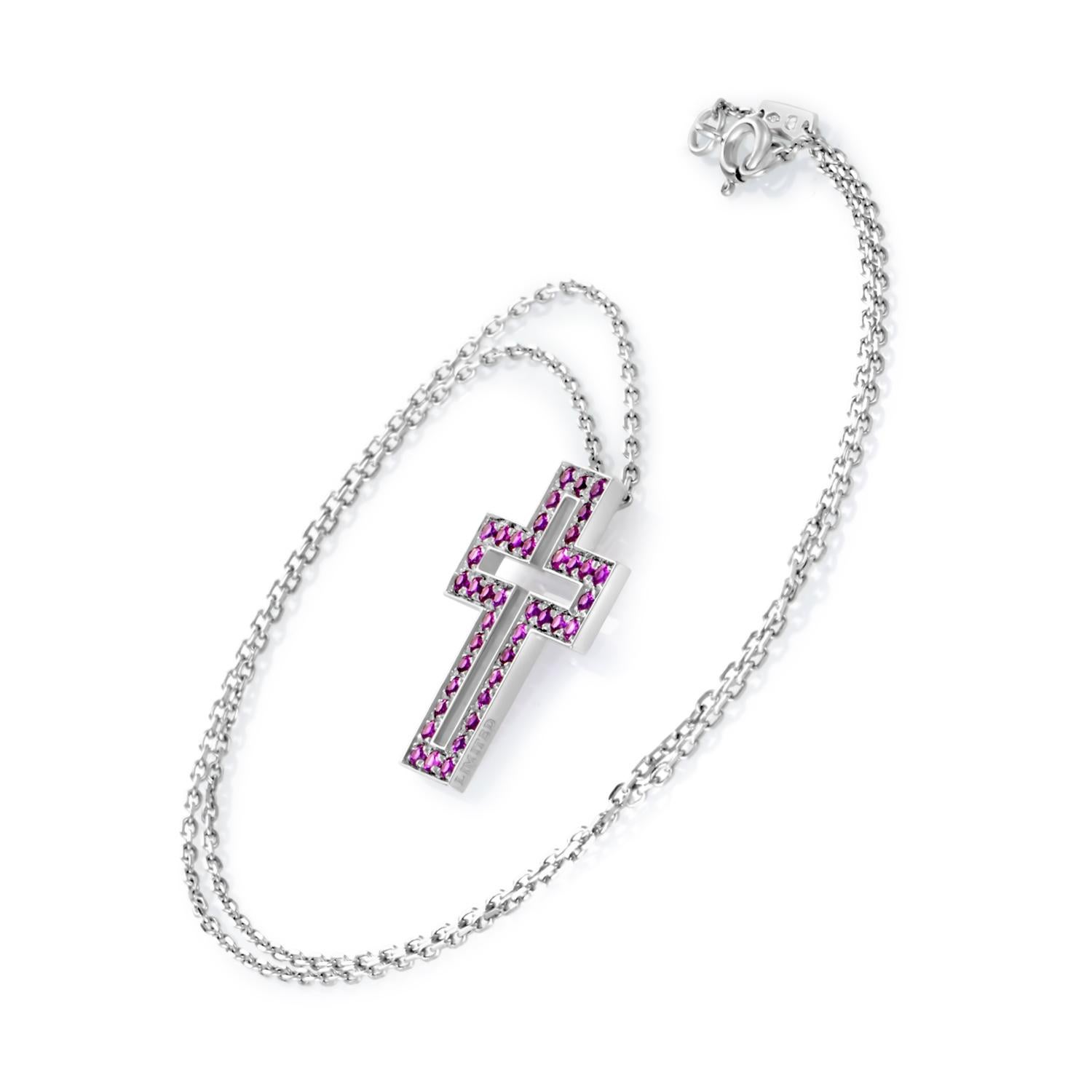 Set in an elegant pendant that assumes the impressive form of a cross, charming rubies in this splendid necklace from Boucheron are perfectly emphasized by the shimmering 18K white gold backdrop.
