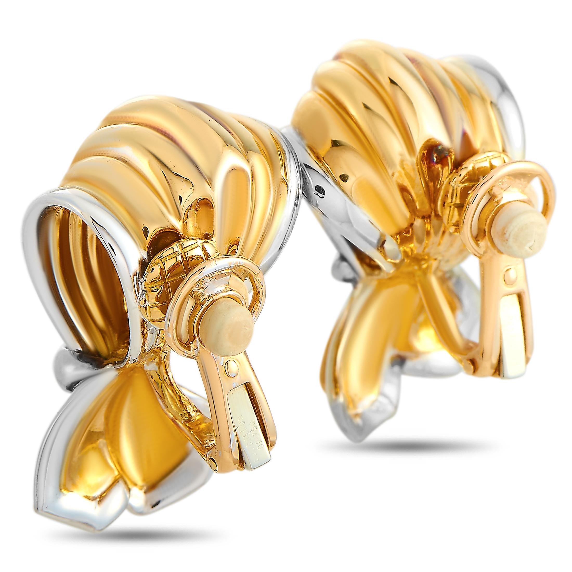 These Boucheron earrings are made out of 18K yellow and white gold and each weighs 15.75 grams. The earrings measure 1.15” in length and 0.75” in width.
 
 The pair is offered in estate condition and includes the manufacturer’s box.
