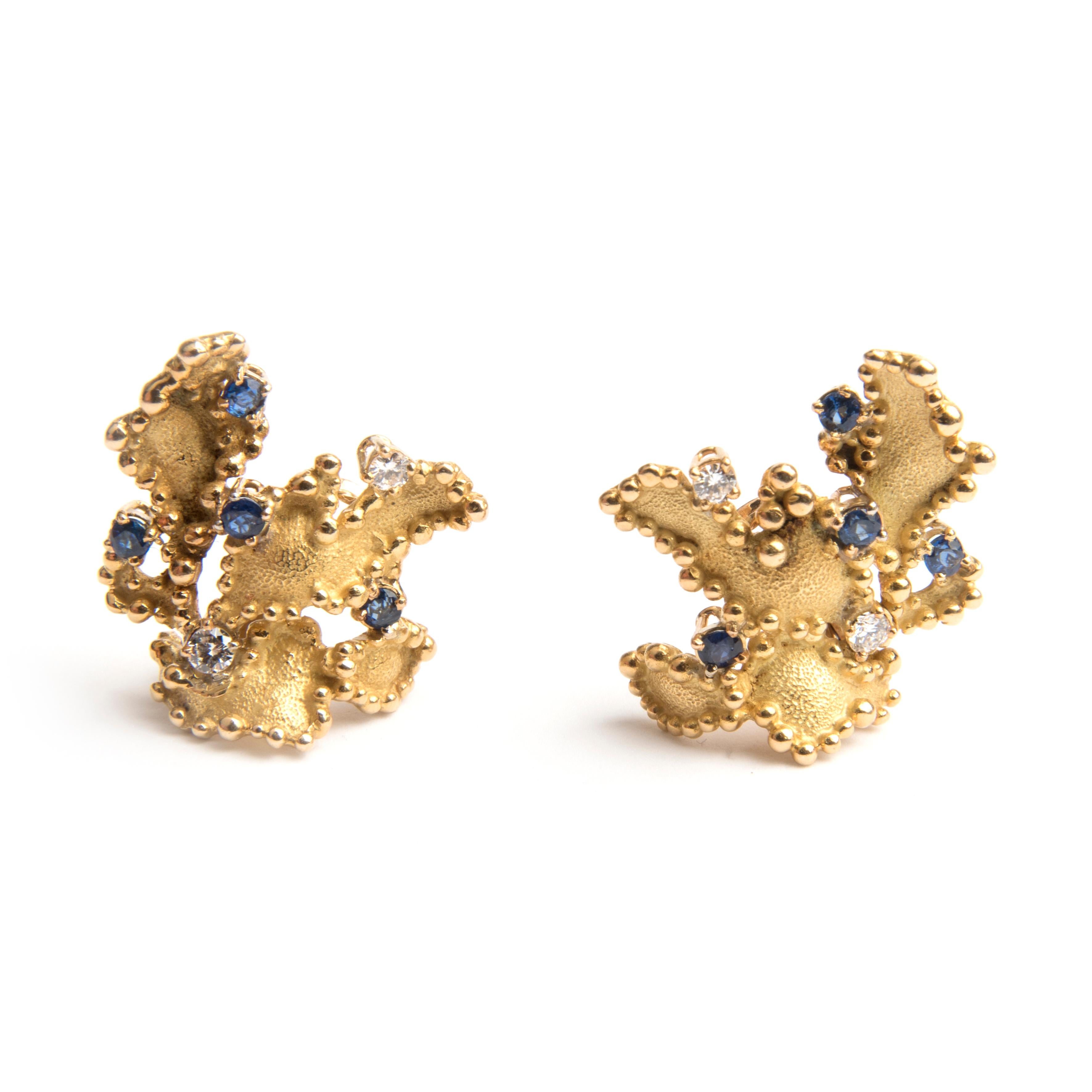 Boucheron clip earrings, designed as three 18k yellow leaves, set with 4 blue sapphires and two diamonds each.
Signed Boucheron Paris, French hallmarks and numbered 37211 
Circa 1970
In original box
