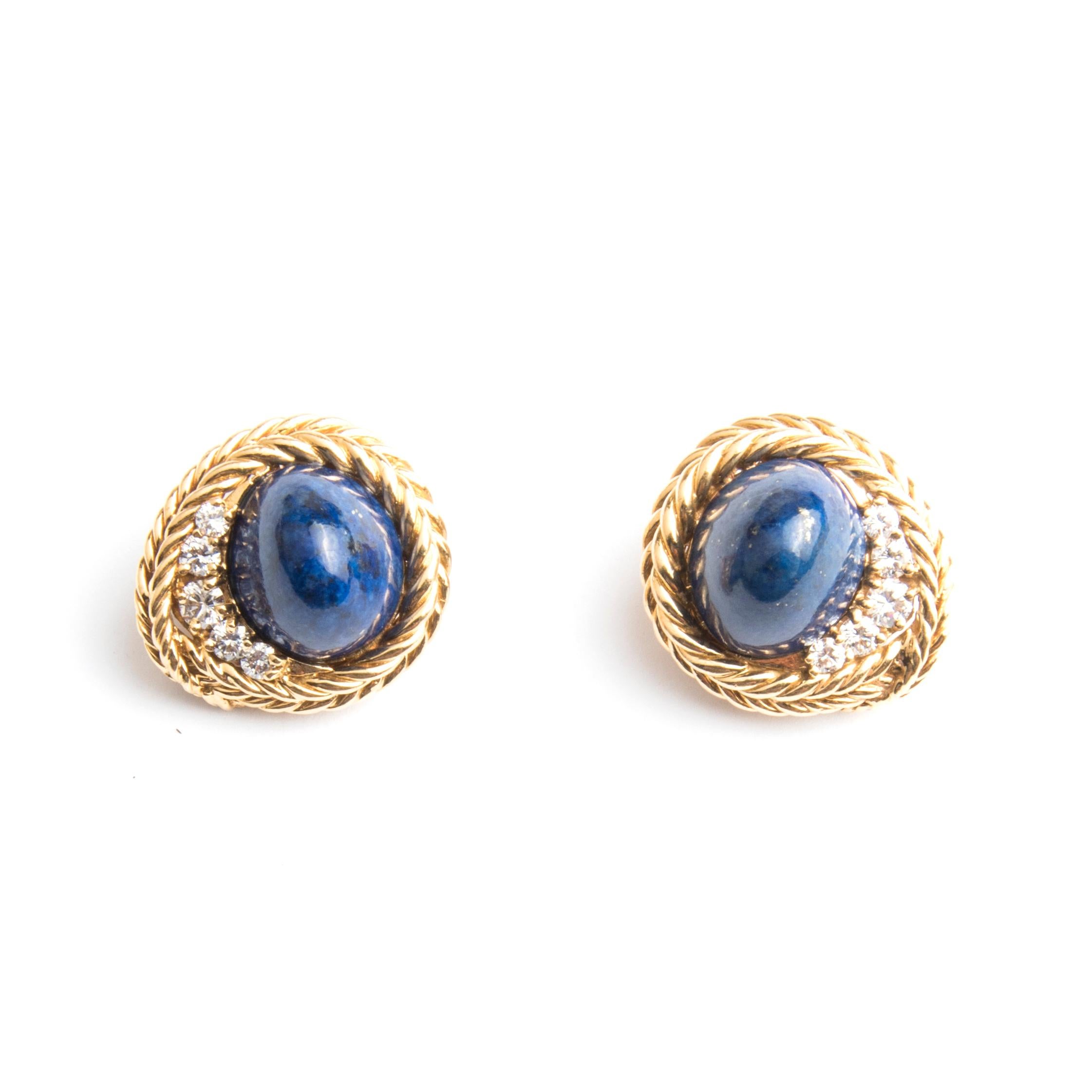 Boucheron set, ring and a pair of earrings. The oval clip-on earrings decorated with sugar loaf lapis lazuli cabochon and diamonds in a double rope motive setting. The ring also with a cabochon lapis lazuli with diamonds on both sides, set in the