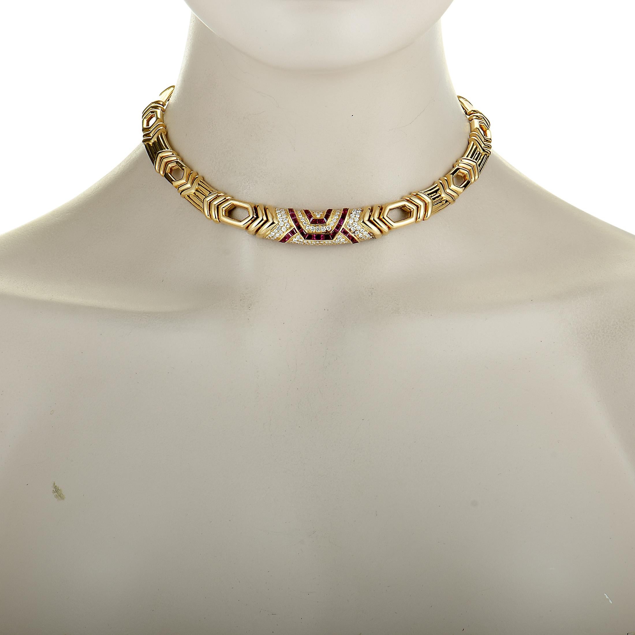 This Boucheron necklace is made of 18K yellow gold, and set with diamonds and rubies. The rubies weigh 2.25 carats and the diamonds total 1.65 carats, boasting grade F color and VVS clarity. The necklace has a chain length of 15”, weighs a total of