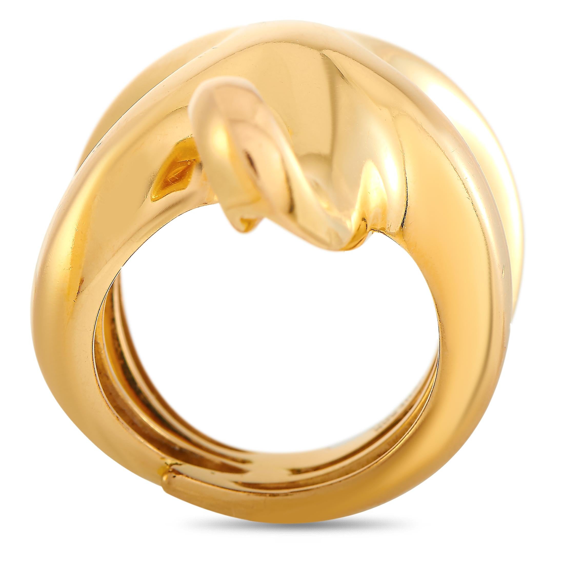 This Boucheron ring is crafted from 18K yellow gold and weighs 17.5 grams. The ring boasts band thickness of 8 mm and top height of 15 mm, while top dimensions measure 25 by 15 mm.
 
 Offered in estate condition, this jewelry piece includes the