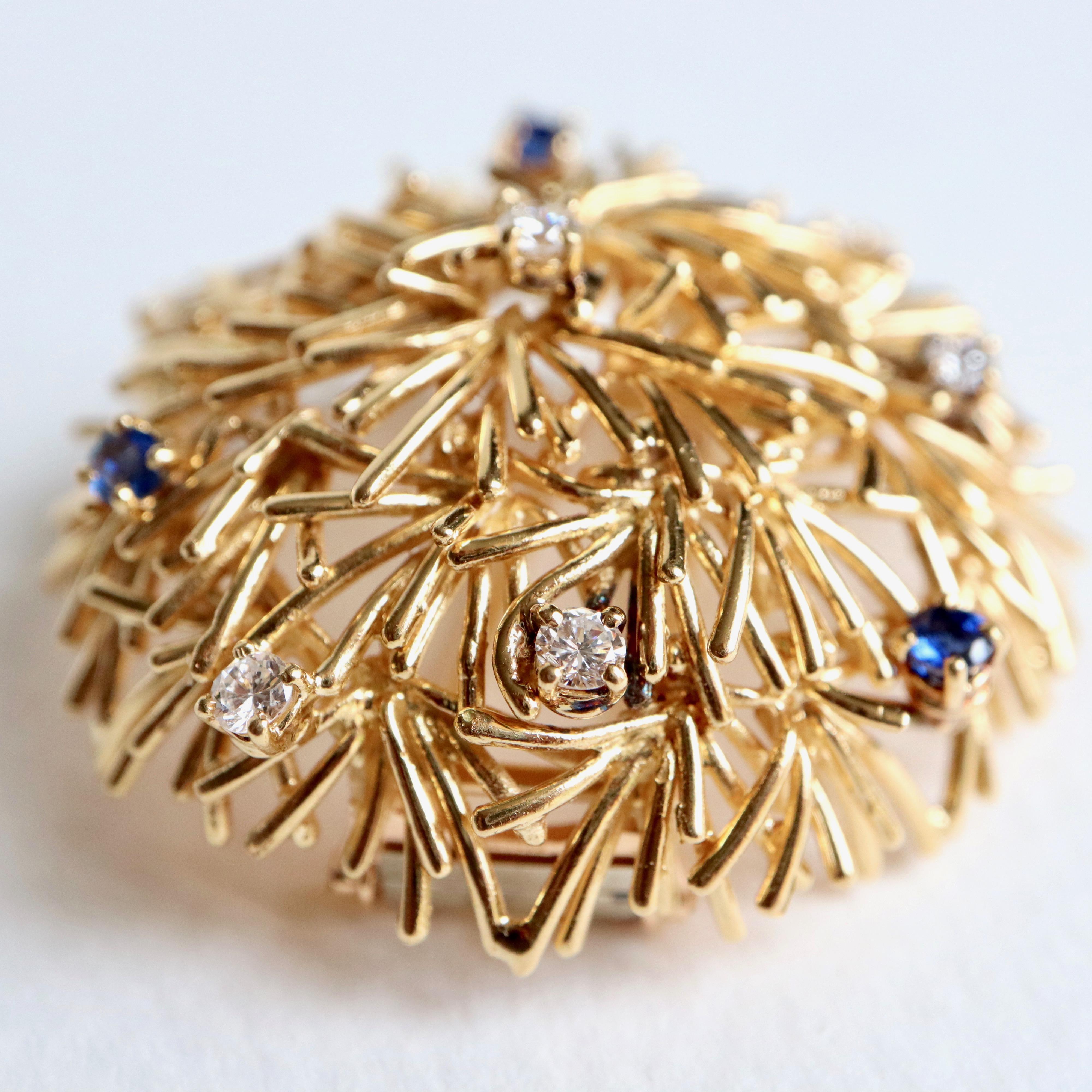 BOUCHERON 18K yellow Gold stylized Thorn Ball Brooch with Sapphires and Diamonds
3 Sapphires and 6 Brilliant Cut Diamonds
Signed Boucheron Paris
Diameter of the brooch: 4 cm
Gross weight: 23.7 g