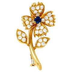 Boucheron 1960s Flower Pin with Blue Sapphire and Diamonds in 18 Karat Gold
