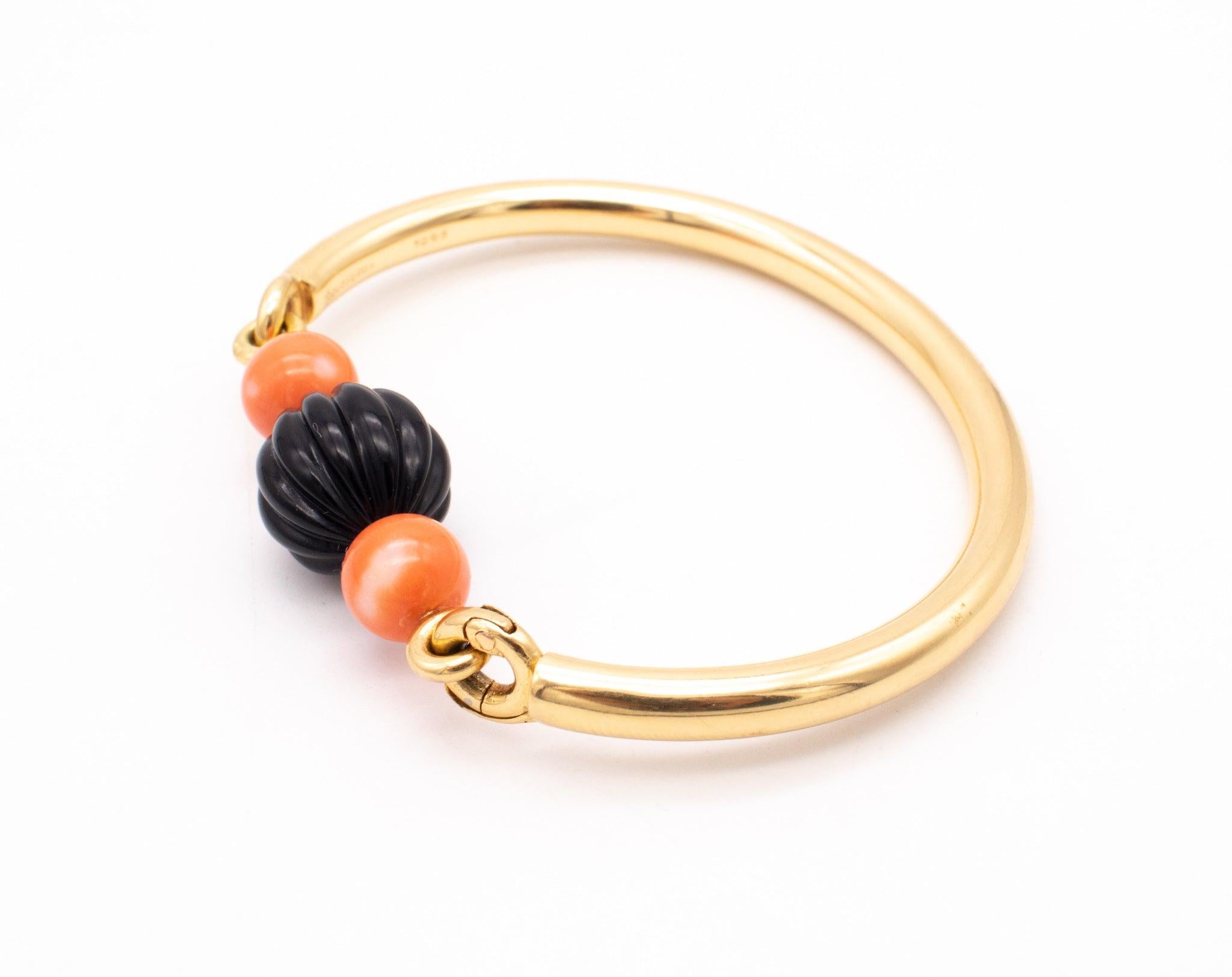 Beautiful bangle bracelet designed by Boucheron.

This is a youthful and very elegant vintage bracelet, created in Paris France by the house of Boucheron back in the 1970. This unusual colorful bracelet was crafted by the master jeweler Jean-Thierry