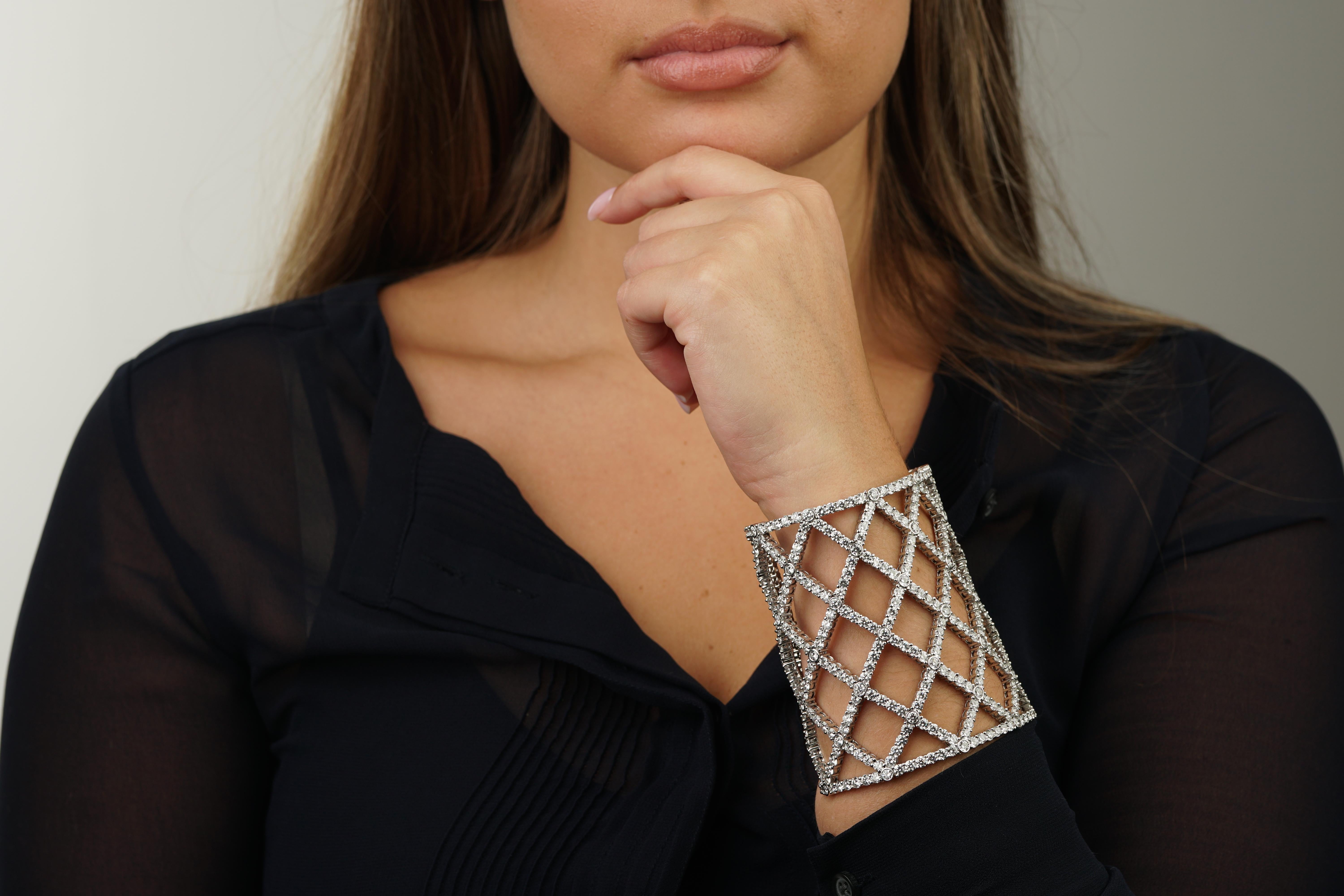 A magnificent Boucheron cuff bracelet boasting 64.47cts of diamonds set in 18k white gold. The diamonds are graded VS quality and better and the bracelet has a weight of 152.8 grams.

