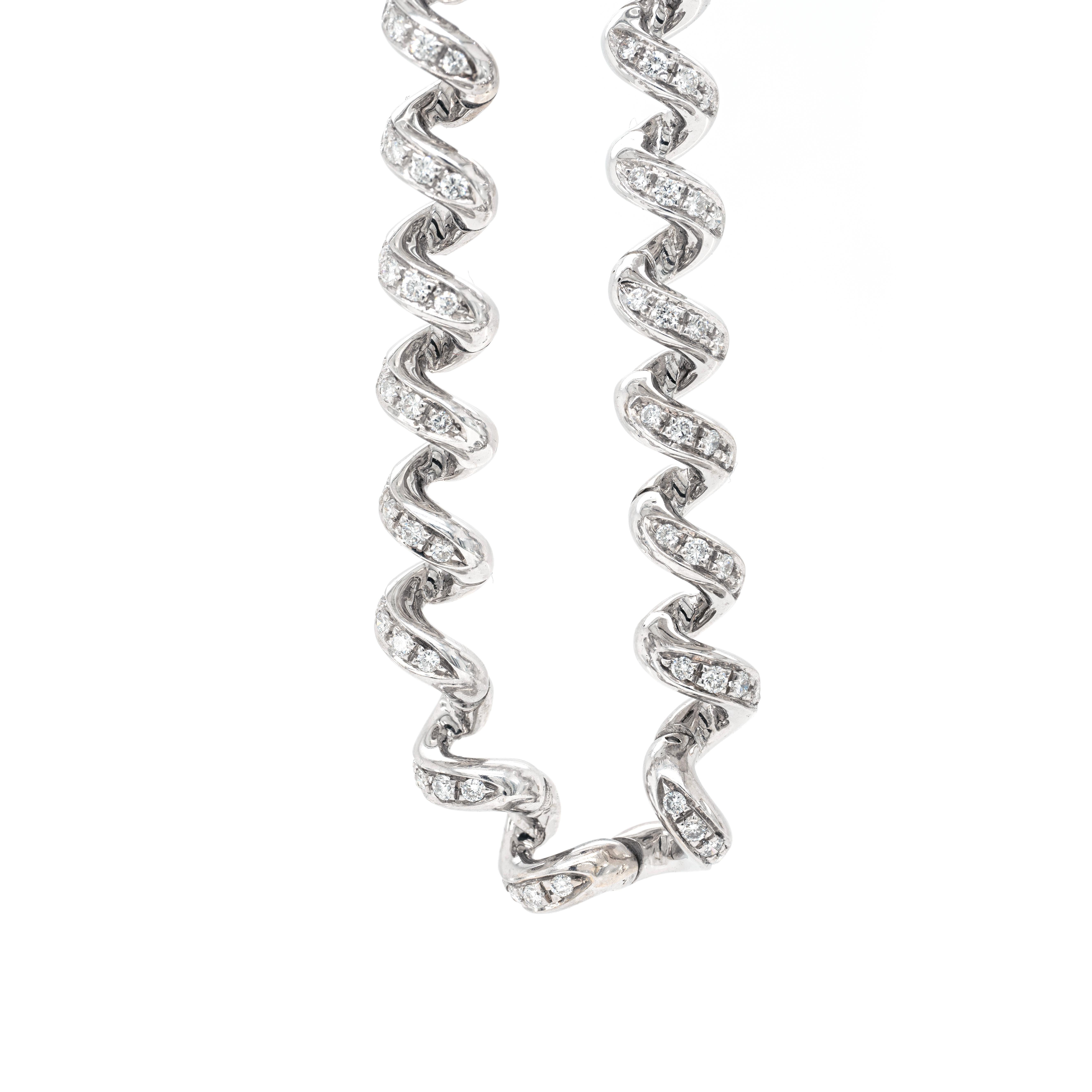 This gorgeous necklace by Boucheron is crafted from 18 carat white gold and designed with high-polished twist shaped links that are masterfully connected to ensure supreme comfort when worn around the neck. Each link is beautifully inlaid with 4