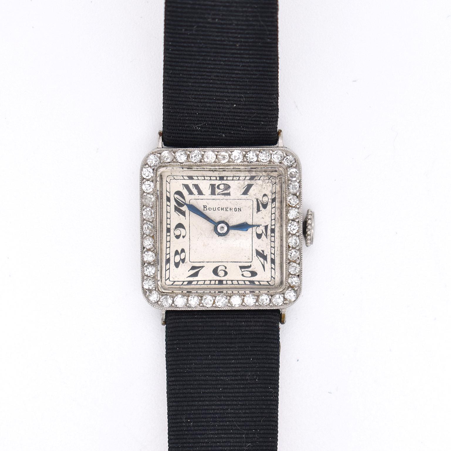 Rare Boucheron Art Deco Platinum & Diamond Watch – Circa 1920

Exquisite Art Deco ladies’ wristwatch by Boucheron, crafted in platinum and set with old-cut diamonds. Featuring a square 20x20 mm case, sword-shaped blued steel hands, and Arabic