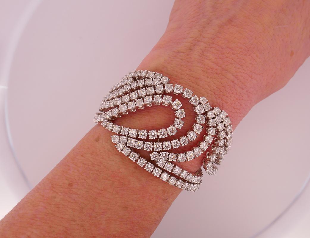         An exquisite Boucheron bracelet made of 18 karat white gold and diamond. 
	This spectacular bracelet has a unique, outstanding design. It comprises of ten flexible gold and diamond strings running towards each other. The strings meet in the