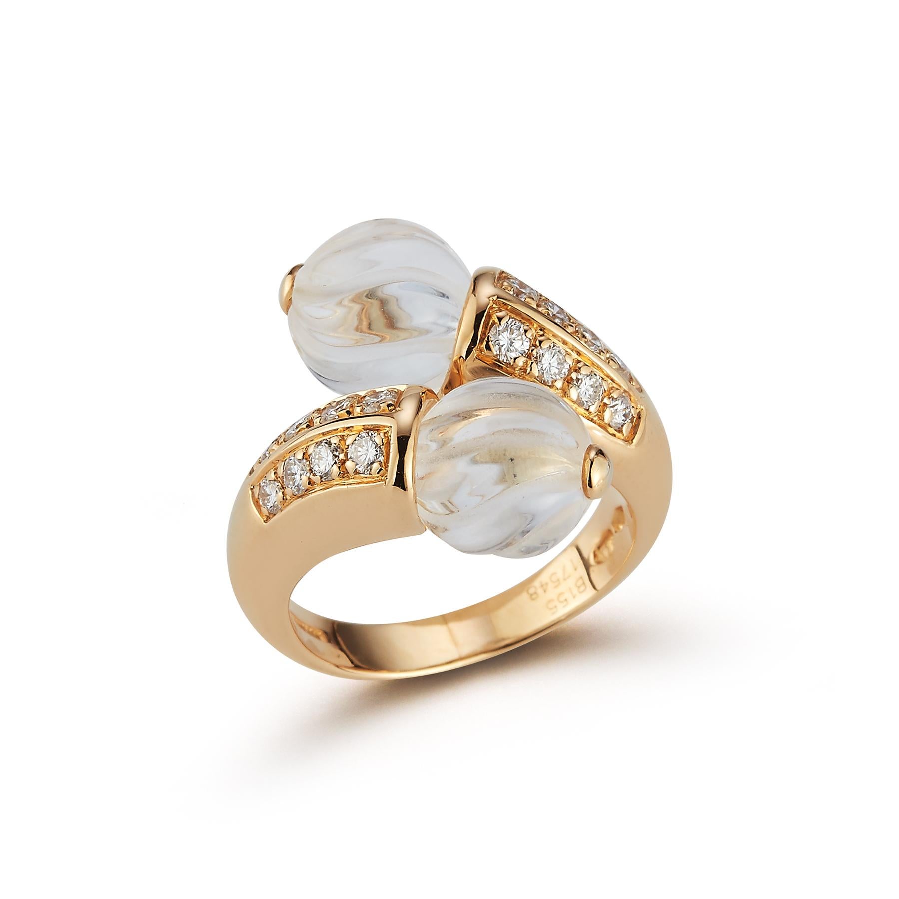 Boucheron Carved Rock Crystal & Diamond Crossover Ring , two rock crystals with round cut diamond approximately .32 cts set in 18k yellow gold 

Ring Size: 6.5

Resizable free of charge

Accompanied with original Boucheron box

