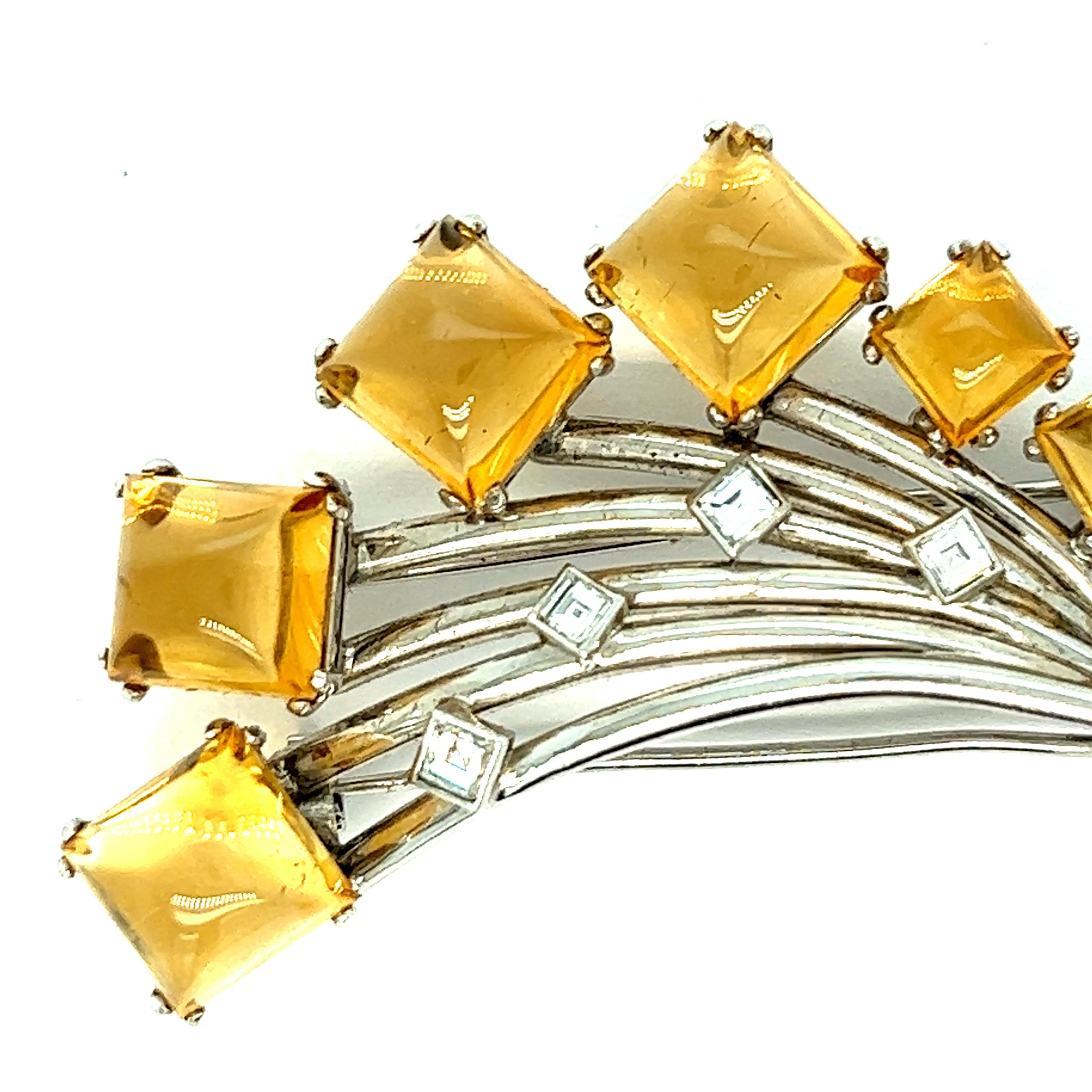 Boucheron citrine diamond brooch

Square shaped cabochon citrines and square-cut diamonds; marked Boucheron

Size: width 2.31 inches, length 1.75 inches
Total weight: 25.1 grams 