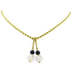 Chaîne collier pendentif Boucheron en cristal, onyx de roche et or jaune