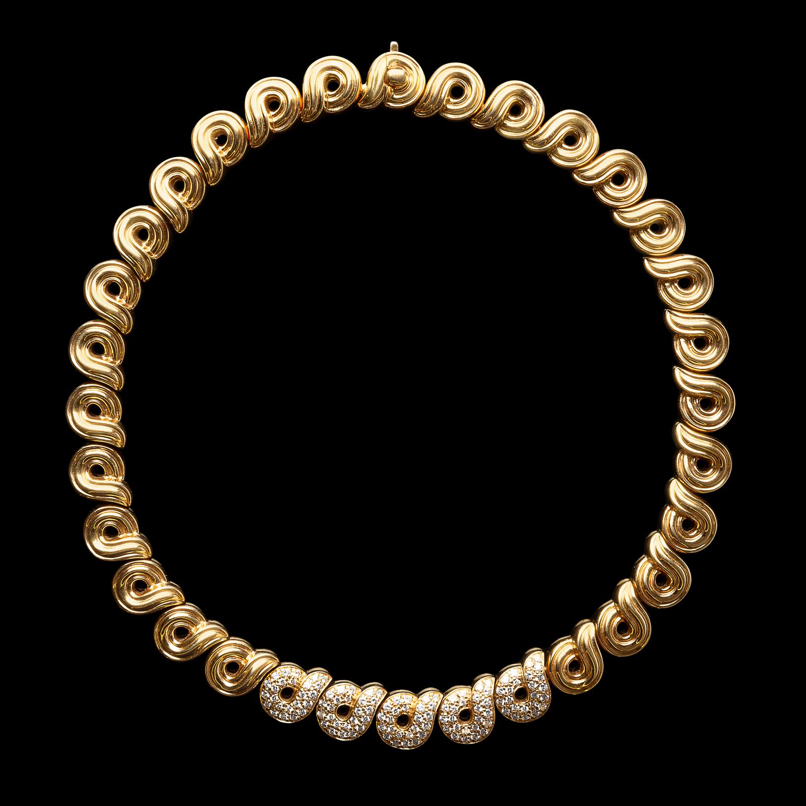 Timeless and elegant, this Boucheron 18k gold collar necklace is designed with spiral links, the central links pave-set with 120 round brilliant-cut diamonds, weighing in total approximately 3.00 carats, F-G/VS. The necklace weighs 118 grams, and