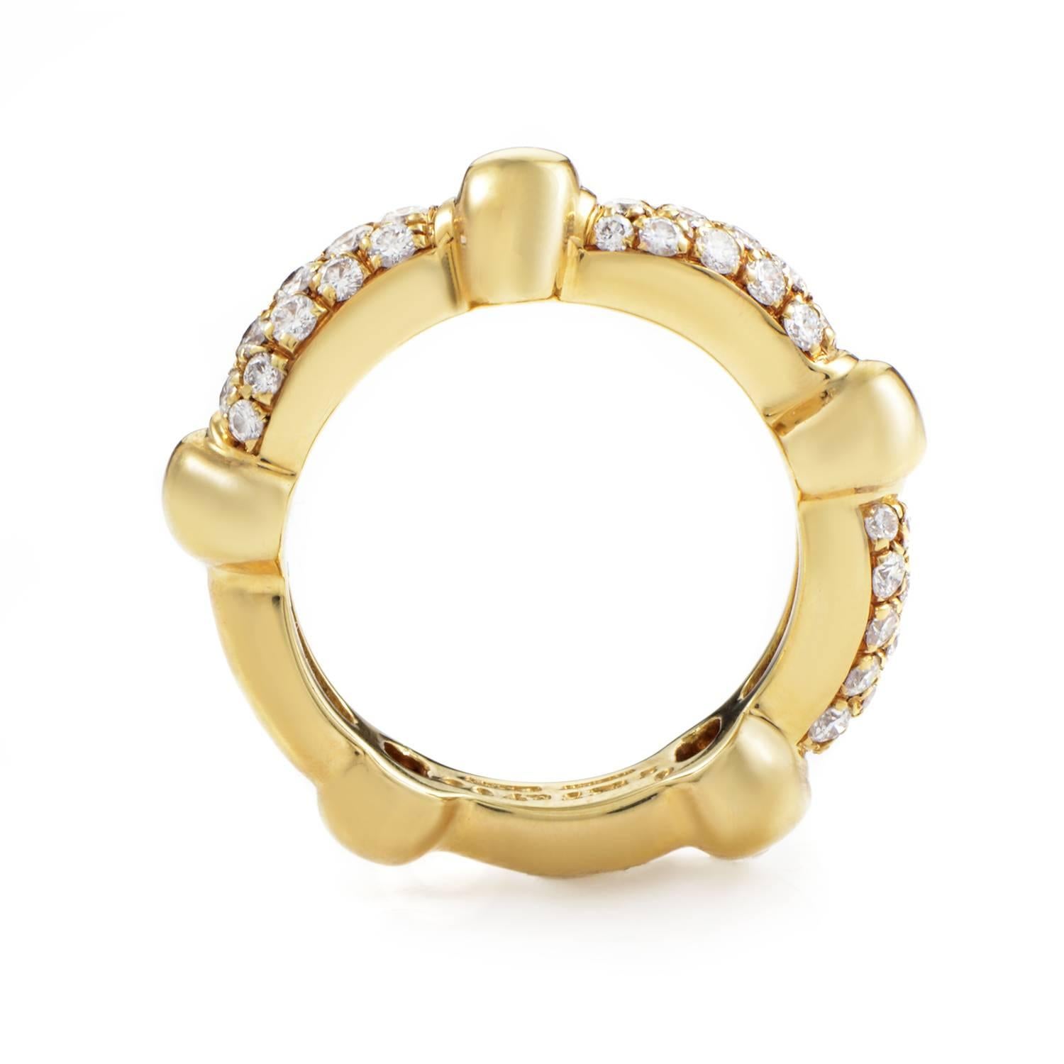 A wonderfully offbeat shape that flows in a smooth and irregular manner, this exceptional band from Boucheron is made of charming 18K yellow gold and adorned with glittering diamonds weighing in total 1.00 carat.

Ring Size: 5.5 (50 1/4)