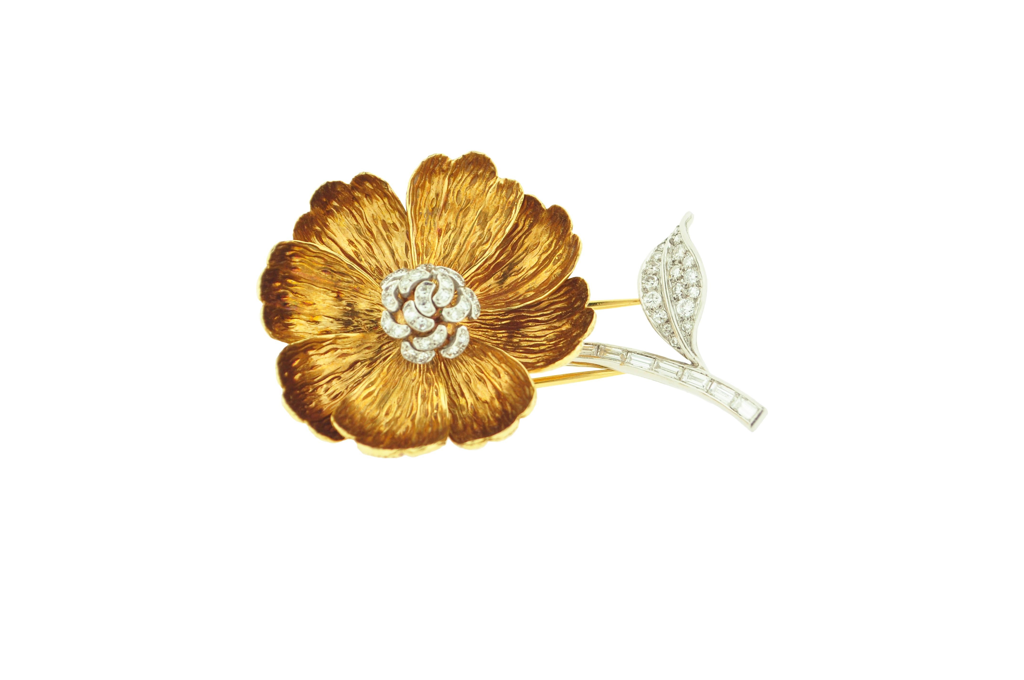 Boucheron flower brooch designed with textured gold petals mounted in 18 karat Yellow Gold and Platinum.

53 diamonds weighing approximately 1.32 carats.

Dimensions: 2.4 in x 1.6 in

Boucheron signed and numbered.